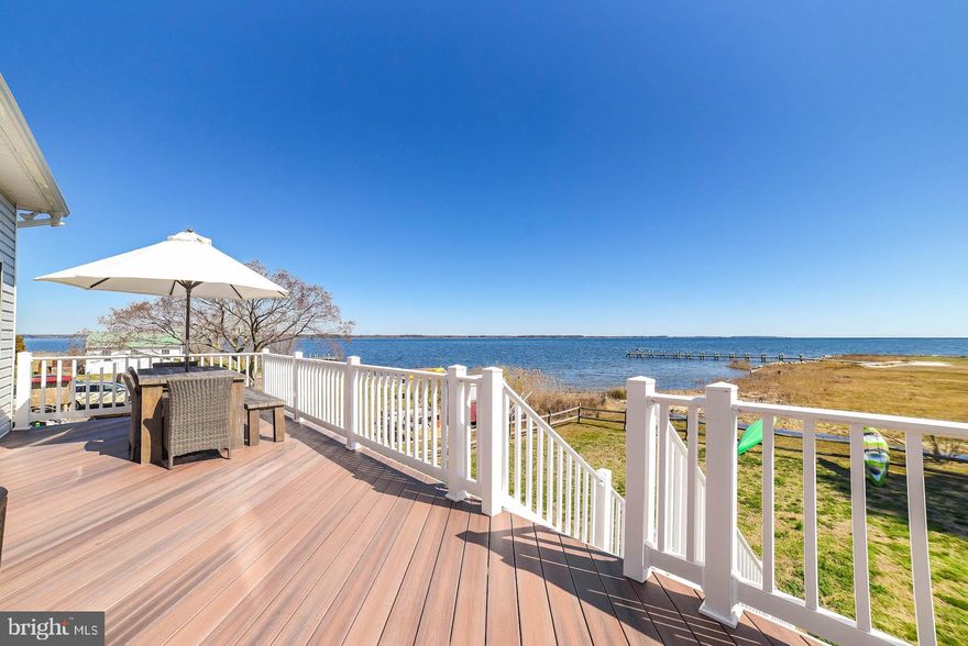Wake up to breathtaking, mile long views of the St. Mary’s River, the Potomac River, and St. George’s Creek from this beautiful three-level waterfront home. Designed with a bright, open floor plan, this residence offers a great floorplan for everyday living and effortless entertaining.
Step outside onto the expansive 42-foot Trex deck overlooking the water — an ideal setting for gatherings, sunsets, and peaceful mornings. Inside, the light-filled kitchen features white cabinetry, granite countertops, stainless steel appliances, and a large center island perfect for cooking and conversation.
The spacious main-level primary suite provides a private retreat with an upgraded tile bath, soaking tub, oversized tile shower, and double vanities. Hardwood floors enhance the main living areas, while the upper level offers two generously sized bedrooms and a full bath.
The lower level includes a two-car garage with abundant workshop and storage space.
Outdoors, enjoy your private beach on parcel 175 that conveys with the sale and offers the ideal location to build your private pier.