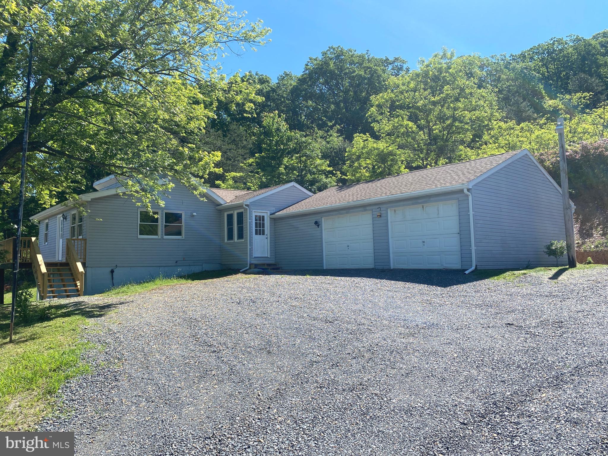 *** MULTIPLE OFFERS. HIGHEST AND BEST DUE BY MONDAY 5/20 at 12N. *** This recently remodeled 2 Bedroom/ 1 Bathroom ranch style home offers you the 5 acres of seclusion you've been dreaming of. Located on a private road in the lovely private community of Timber Mountain. Before you even walk through the front door you can't help but to take in the beautiful view from the deck so bring your adirondack chairs, relax and enjoy! Once inside you'll appreciate the tasteful remodel. Brand new flooring throughout. The whole house has been freshly painted. The bathroom is completely new from top to bottom. Speaking of new...check out the kitchen! Brand new stainless steel appliances, counters, lighting, and more. There is a nice sized bonus room off the kitchen leading into your oversized two car garage with a built-in work bench. The lawn is lush and green, and the country air is fresh! Live here year 'round or enjoy as your second home in the country.