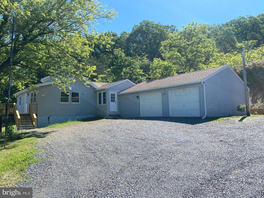 *** MULTIPLE OFFERS. HIGHEST AND BEST DUE BY MONDAY 5/20 at 12N. *** This recently remodeled 2 Bedroom/ 1 Bathroom ranch style home offers you the 5 acres of seclusion you've been dreaming of.  Located on a private road in the lovely private community of Timber Mountain. Before you even walk through the front door you can't help but to take in the beautiful view from the deck so bring your adirondack chairs, relax and enjoy! Once inside you'll appreciate the tasteful remodel. Brand new flooring throughout. The whole house has been freshly painted. The bathroom is completely new from top to bottom. Speaking of new...check out the kitchen! Brand new stainless steel appliances, counters, lighting, and more. There is a nice sized bonus room off the kitchen leading into your oversized two car garage with a built-in work bench. The lawn is lush and green, and the country air is fresh!  Live here year 'round or enjoy as your second home in the country.