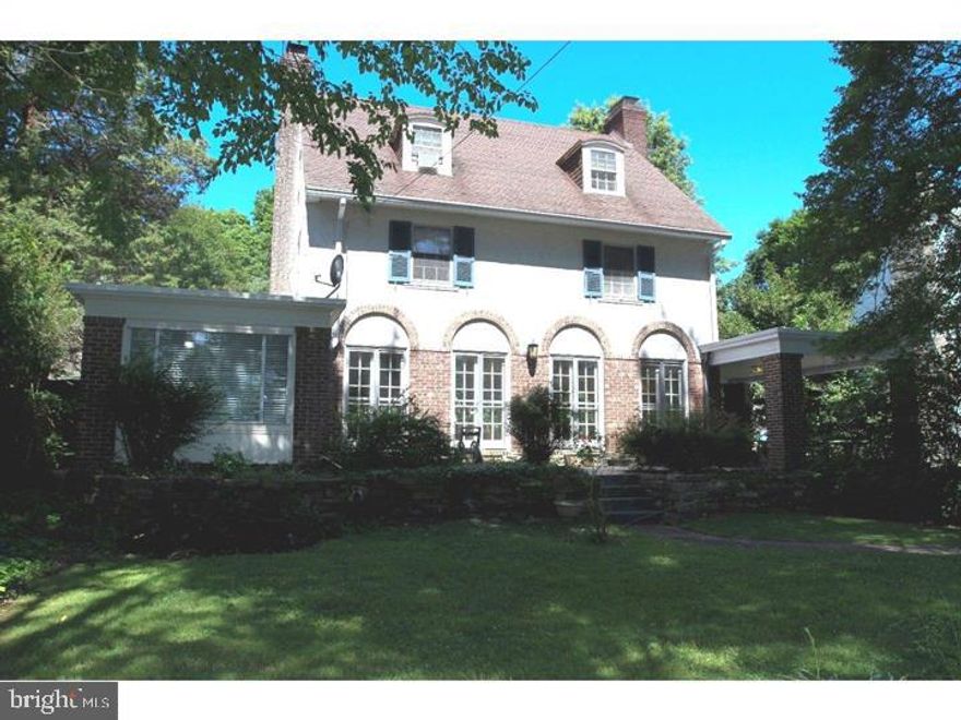 Absolutely spectacular & stunning French colonial 5 bedroom 3 bath plus a powder room, a true Lower Merion Gem. The private driveway leads you to this stately 5 bedroom 3 1/2 bath private retreat. This classic Colonial has everything you are looking for,space,privacy & convenience. A  kitchen with granite counter top includes top of the line Whirlpool appliances, a Terra Cotta floor, a true Cooks kitchen, a Chefs dream that includes an eating area. This leads to a sunny large Formal Dining room complete with a working Fireplace to make those winter mornings and summer nights a welcoming entertaining area. The Dining Room opens to a covered porch for your outdoor enjoyment. The large front to back Living Room has a wood burning fireplace and great natural light streaming in from a huge picture window that opens to an all season Sun room, perfect for cozying up to a good book. The Living Room and Dining Room have hardwood flooring. All bedrooms are spaciously proportioned located on the top two floors. The second floor has three or four bedrooms with Jack and Jill bathrooms connecting the bedrooms, the fourth Bedroom may be used also as an office or an over sized closet. What a bonus that this room contains full Washer and Dryer hook ups to make this a home with laundry on the upper floor, along with full sized Washer and Dryer located in the basement. The third floor is finished to include two additional over sized bedrooms with another full bathroom. The back yard and patio are the perfect setting to relax and enjoy the perennial gardens.  A large detatched two car garage . The mud room is accessible in the landing of the large unfinished basement with its own outside entrance. This home is a must see.