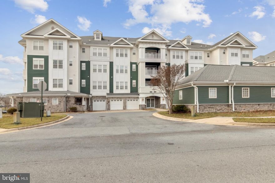 OPEN HOUSE - APRIL 14th, 2PM-4PM. Bright and spacious condo in beautiful Victoria Falls!  Second floor unit with large rooms and tons of light.  Large kitchen with loads of cabinets and counter space.   Separate dining room that leads to a comfortable living room and access to a private balcony.  Two oversized bedrooms both with ensuite bathrooms.  Excellent closet space.  Hardwood floors. In-unit washer and dryer.  Separately deeded garage parking.  Pet friendly 55+ community with many amenities including clubhouse, pool, workout facility, tennis, and beautifully landscaped exterior spaces.