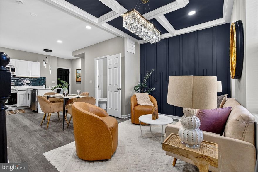 Welcome to this beautifully renovated home offering 4 spacious bedrooms, 3.5 bathrooms, and four fully finished levels of modern living in the heart of Baltimore City! The main level features an inviting open-concept layout with a stunning accent wall and elegant tray ceiling detail that adds character and style. The brand-new kitchen is a showstopper, complete with quartz countertops, custom backsplash, peninsula seating, modern lighting, and sleek finishes, plus a convenient half bathroom for guests.

The second level offers two generously sized bedrooms and a full bathroom, while the entire third level is dedicated to a private owner’s suite retreat. Enjoy a spacious bedroom with a beautiful accent wall, a large walk-in closet, and a luxurious spa-like bathroom featuring a separate shower and soaking tub for that modern, upscale feel. The fully finished basement provides additional flexibility with front and rear private entrances, a bedroom, full bathroom, and washer and dryer included, ideal for guests, or additional living space. Step outside to a fully fenced rear yard.  Don’t miss this incredible opportunity to own a stunning, move-in-ready home in a highly accessible Baltimore City location. Schedule your private tour today and make 1431 E Preston St yours!