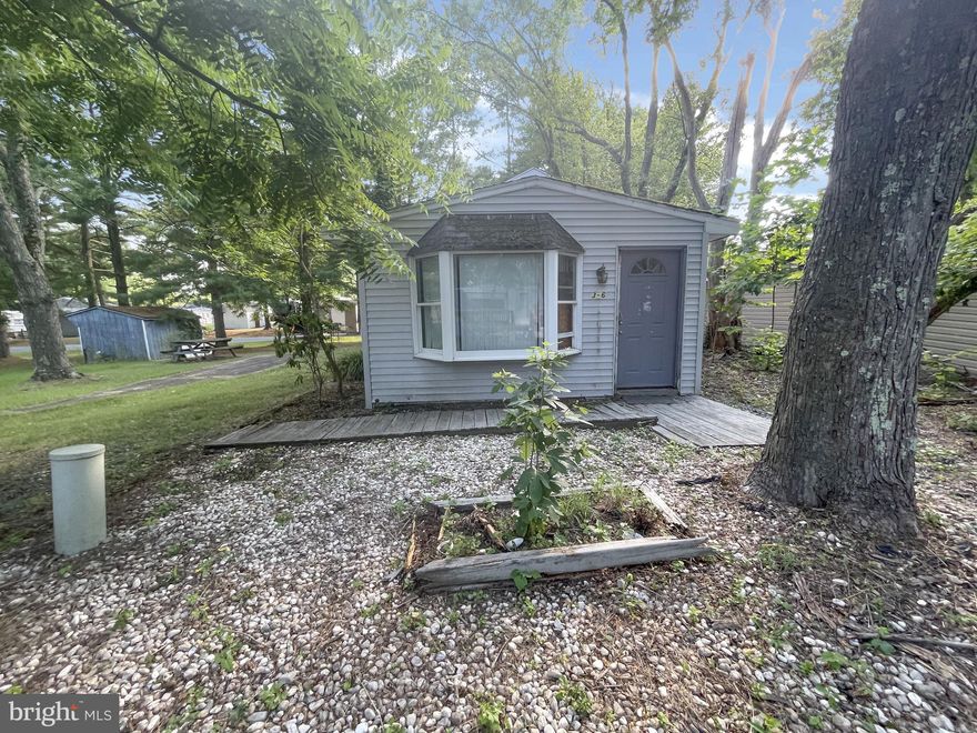 Don't miss this wonderful opportunity to own this home in the water oriented community of Indian Acres. Home features a formal living room with large bay window , kitchen-dining combo with appliances, three bedrooms, a full bath with whirlpool tub and a laundry room.  The  Indian Acres Campground, which is limited to 150 days a year no more than 100 consecutive days (not a full time residence) is a gated community with lots of activities, pools, boat ramp. lake, two ponds and bath houses available.