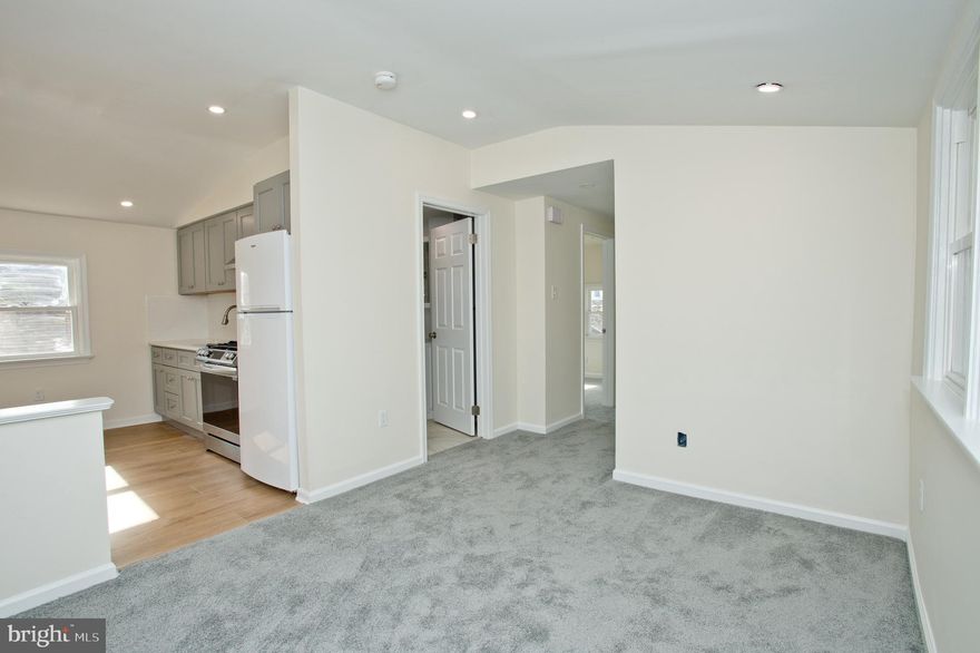 Completely Renovated 2nd Floor Apartment now available on Quiet  Street in Sought after Ardmore.  A short walk to Restaurant and Night life and minutes from Suburban Square and Public Transit to Center City. Exterior Stairs lead up to the Private Deck and Entrance to the Unit. EVERYTHING New, Open Living Room and  Kitchen with Plenty of Custom Cabinets. Full Bath in Hallway with Ceramic Tile and Shower Surround.  Nice Sized Main Bedroom plus Bonus Room for Office or possible 2nd Bedroom with Brand New Washer and Dryer.  (washer and dryer located in 2nd Bedroom) New Wall to Wall Carpeting  plus 3 separate Mini split units for Heating and AC will have you comfortable year round.  Plenty of Street Parking and you also have Access and Use to the Large Back Yard plus a  small storage area in the basement.  No Pets allowed, Available for 1 or 2 year lease.