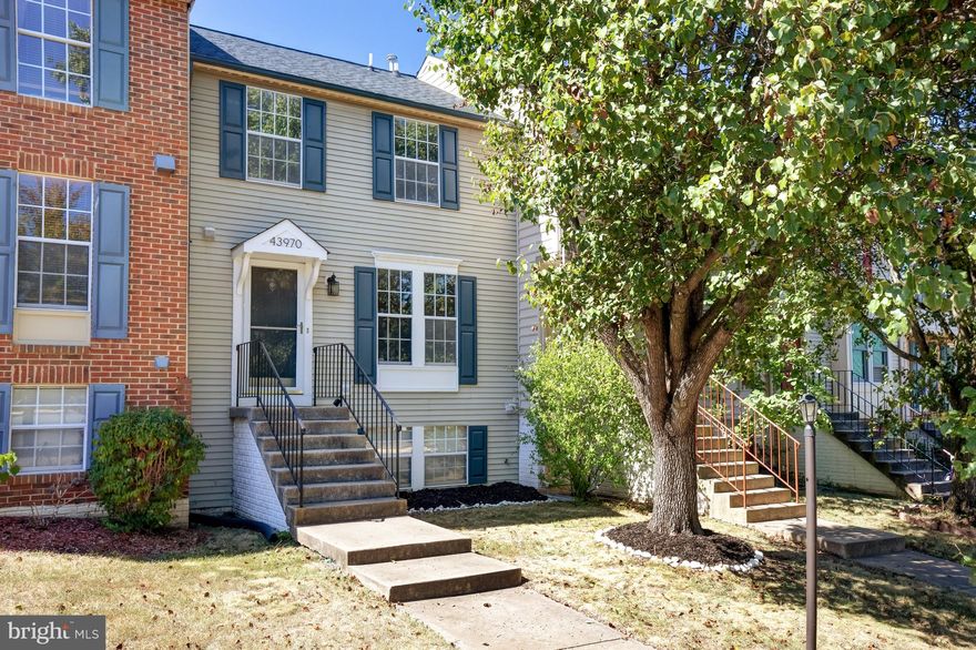 Welcome to your new home at 43970 Choptank Terrace in the heart of Ashburn Village! This charming 2-bedroom, 2.5-bathroom townhouse is the perfect blend of comfort and style, offering an array of modern amenities and an unbeatable location. Step inside and be greeted by a beautifully appointed kitchen featuring gleaming granite countertops, stainless steel appliances, recessed lighting, and an inviting breakfast area. With ample cabinet space, meal preparation and storage will be a breeze. The bathrooms have been thoughtfully updated with contemporary vanities and fixtures, providing a touch of luxury.  Enjoy the great outdoors from your private deck that backs to an enormous common area and a scenic walking trail. Whether you're sipping your morning coffee or hosting a BBQ, this space is perfect for relaxation and entertainment. The finished basement offers versatility and comfort, complete with a full bath and a cozy wood-burning fireplace. It also provides convenient access to the patio and fenced yard, making it an ideal space for gatherings and play. Ashburn Village boasts a thriving community with an array of amenities including the Ashburn Sports Pavilion, offering a Health Club, Olympic indoor pool, Pier/Dock, Fitness Center, and more. You'll also have access to numerous outdoor swimming pools, basketball courts, a clubhouse, common grounds, jogging/walking paths, a picturesque lake, party rooms, tennis courts, racquetball, and tot lots. Conveniently located just minutes from the Dulles Greenway, you'll have easy access to major roadways. Additionally, the W&OD Trail is only 1 mile away, providing endless opportunities for outdoor activities. For your entertainment and dining needs, you'll find movie theaters, vibrant nightlife options, quality dining establishments, and a plethora of breweries all within a short drive. If you're a commuter, you'll appreciate the proximity to the Ashburn Metro, making your daily commute a breeze. Don't miss out on this fantastic opportunity to own a piece of Ashburn Village living. Schedule your showing today and make this your new home sweet home!