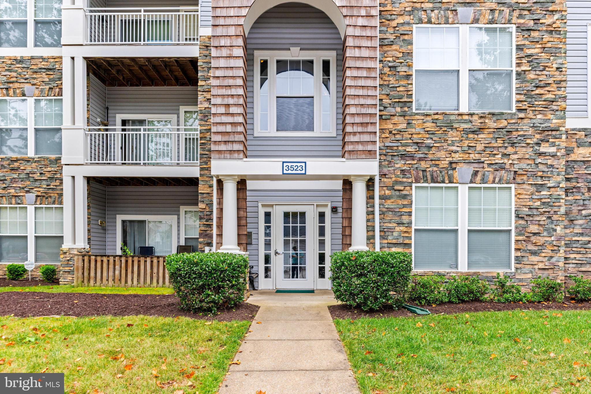 Welcome to 3523 Piney Woods Place, a beautifully maintained condo featuring three spacious bedrooms and two full bathrooms, including a generous primary suite with its own private bath. Both bathrooms and much of the flooring have been recently updated, and the home has been freshly painted! A large great room seamlessly connects to the dining and family areas, creating an open and inviting flow, while the roomy kitchen offers plenty of space to cook and gather. Convenience is enhanced with a newer washer and dryer and elevator access in the building. You'll have plenty of space to host family or friends in the great room, or enjoy some quiet time in the sun on your own private balcony. The community provides an incredible array of amenities, including a clubhouse, outdoor pool, tennis and volleyball courts, playgrounds, bike and jogging paths, and even a library. Condo fees cover these amenities along with water, sewer, lawn care, and snow removal, ensuring stress-free living. Set in a quiet neighborhood, the location is unbeatable—just minutes from downtown historic Laurel and Fort Meade, equidistant between Washington, D.C. and Baltimore, and surrounded by endless shopping, dining, and entertainment options.