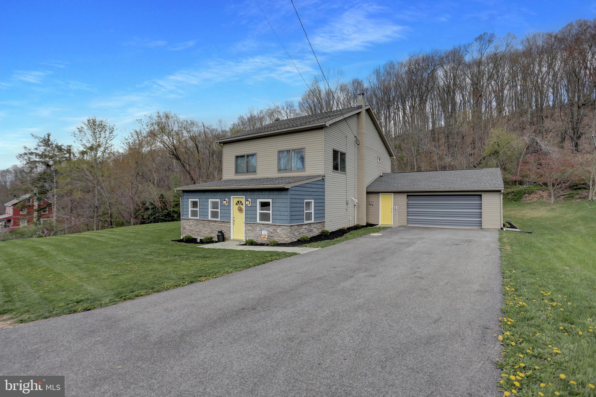 Nestled on a peaceful .63-acre lot in Glen Rock, PA, this fully updated multi-level colonial home at 1734 Hametown Rd. offers a harmonious blend of modern comforts and natural beauty. Just minutes from I-83, this home provides a serene retreat with easy access to all the essentials.
Step inside and discover a thoughtfully renovated space that’s much larger than it first appears. The home has been transformed with a host of contemporary upgrades, including an added laundry room, walk-in pantry, and spacious bedroom closets. A dedicated home office with tile flooring and French doors provides the perfect work-from-home space, while a tiled entry foyer is designed to accommodate all your seasonal gear.
The heart of the home is the open kitchen, a chef's dream featuring brand-new white soft-close cabinetry, sleek granite countertops, a timeless subway tile backsplash, and stainless-steel appliances. A spacious center island with a breakfast bar is ideal for meal prep, casual dining, or simply gathering with friends and family. A custom coffee bar area is perfect for those cozy mornings, and a wine fridge adds a touch of sophistication.
Luxurious vinyl plank flooring flows seamlessly throughout the home, adding both elegance and durability. The open floor plan connects the kitchen, dining, and living areas, which flow into the inviting family room below. Whether you're hosting gatherings, helping with homework, or simply relaxing, these spaces adapt to your needs.
Each of the three levels features a beautifully tiled full bathroom, offering both style and privacy for the entire family. The primary bedroom suite is a true retreat, complete with two closets (including a walk-in), a bathroom with a deep soaking tub, a tiled walk-in shower with a sliding glass door, and a double vanity.
Outside, the newly added hardscaping and walkways enhance the home's curb appeal, providing a perfect backdrop for outdoor activities or quiet moments in nature. The spacious yard offers endless possibilities for gardening, play, or simply unwinding. An outbuilding with power awaits your creative touch—whether it’s a workshop, art studio, or extra storage, the choice is yours.
This home is a rare find, offering a perfect blend of privacy and convenience. Located near schools, parks, grocery stores, and dining, it’s a place where comfort, style, and nature all come together. Don't miss out on the opportunity to see this home in person