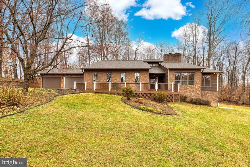 One of the most unique properties on the market!  This incredible home offers the ultimate private retreat.  Situated at the end of a cul de sac,  down a private tree lined driveway, is the home you have been waiting for.  There is plenty of parking in the attached 2 car garage and the detached 2 car garage with heating and AC, and a built in stereo system . It's an ideal place for the hobbyist, car enthusiast, or even convert it to a professional gym space.  The front door of the home opens up to a sizable foyer with plenty of coat closet space.  There is a formal living and dining room to the right with an entrance to the kitchen space.  The kitchen offers granite counters, multiple skylights, and tons of cabinet and counter space for all your storage and food prep needs.  Off of the kitchen is a breakfast nook with a slider to the deck.  The entire space opens up to the oversized family room that is the perfect space for family gatherings, or to watch the big game!  There is a wood burning fireplace with a stone surround from floor to ceiling.  It's a gorgeous, dramatic look that truly gives the home a farm house/cabin feel.  Down the hall is a second family room space that would make an awesome game room, play room, craft space or more.  There are 2 full bathrooms and 2 generous sized bedrooms down the hall as well.  Travel up one flight of stairs to the incredible primary suite that overlooks the wooded backyard, with miles of closet space, and a deluxe primary bath with double sinks, a bidet, and a HUGE jetted tub to relax in after a long day at work.  The lower level offers 2 den/office spaces PLUS a 4th bedroom.  There's a lower level kitchen so you could even convert the space to an in-law suite!  There is an expansive lower level rec room with a slider to the backyard.  And this backyard......WOW! There is a section that is fully fenced with a custom built playhouse.  This is a truly a nature lovers dream with deer, and fox, and turkeys that will visit the wooded surround.   Come and take a peek at this truly special home!