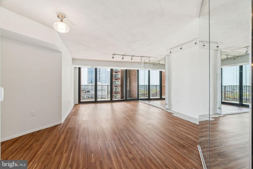 Deluxe one bedroom on a high floor of Academy House with see-forever sunrise city views. This spacious home features beautiful natural light from oversized windows, great entertaining space, and a large private terrace with incredible views over the city all the way to the Delaware River. Enter through a spacious foyer with tile floor, two coat closets, and conveniently located powder room into the light-filled great room. The great room boasts great entertaining space, a separate open dining area, and access to the private terrace, perfect for enjoying a morning cup of coffee. The fully equipped kitchen features custom wood cabinetry, excellent counterspace, mirror backsplash, and a breakfast bar. The spacious bedroom suite features a sun-soaked bedroom with built-in shelving and access to the terrace, wall of closets, large walk-in closet, and ensuite bathroom with single vanity, accessible tub shower, laundry closet with stacked washer/dryer, and tile floor. There are new vinyl floors in the great room and bedroom and fresh paint throughout. The Academy House is located in the heart of Center City and within close walking distance to Rittenhouse Square, Washington Square, and the Broad Street and Market Street office corridors. The Philadelphia International Airport and Amtrak's 30th Street Station are easily accessible.