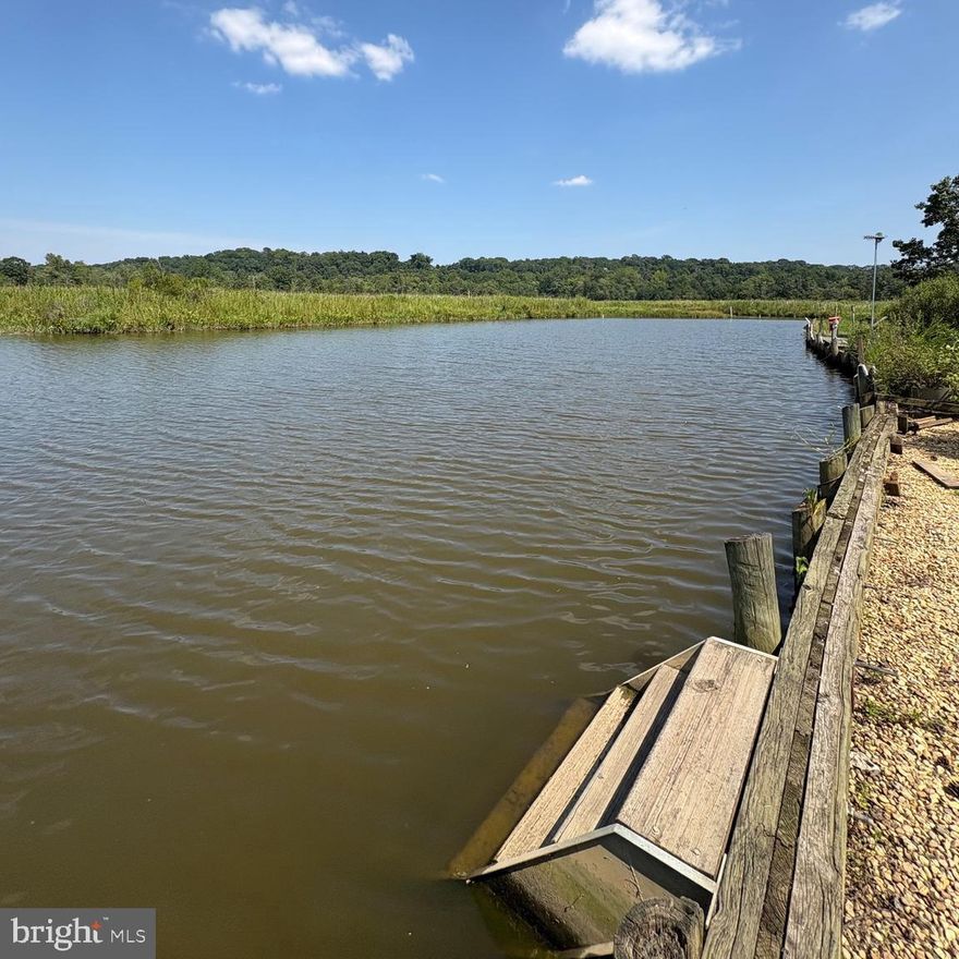 Waterfront RV Lot #4 located in the gated Port Tobacco Waterfront RV Resort. This waterfront lot includes its own private electrical box installed in 2020 with active electric service as well as water hookup at the site. Stairs at the bulkhead provide easy access to the water for launching or boarding a small boat directly from the lot.

The resort also offers a private community boat ramp with boat storage. Owners and guests enjoy access to a clubhouse featuring a full kitchen and game room facilities located just a short walk from the lot.  PTRV is going to be resurfacing gravel drives and parking areas, including boat storage, over the coming weeks.

Ideally situated within walking or boating distance to Port Tobacco Marina and the Port Tobacco Restaurant, this property offers a great opportunity to enjoy boating, fishing, and relaxing on the water.

The camper and any personal property currently on the lot do not convey and will be removed prior to settlement. Additional details and photos coming soon.