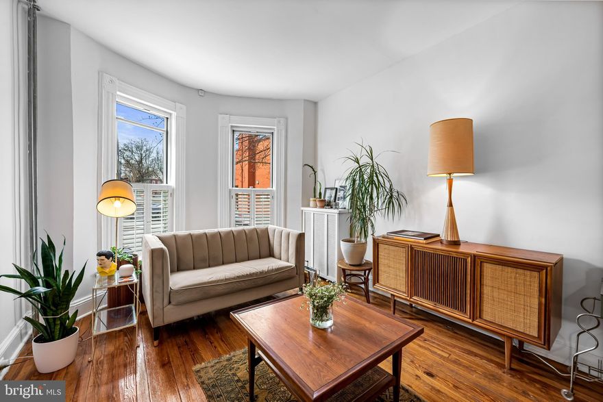 This Hampden home has the warmth and personality that make Baltimore homes so special. Exposed brick, crown molding, hardwood floors, and original 1920s details throughout bring the kind of charm that buyers are always hoping has not been stripped away. Thoughtful modern updates feel true to the house, which is a rarity in a sea of fast flips. It’s cute, inviting, and the cherry on top is the perfect location.

The main level offers a spacious and comfortable layout with a living room and dining room that flow right into the galley kitchen. Just beyond, the backyard offers a lovely green space with a native plant garden that will bloom through spring and summer 

Upstairs, three rooms offer the flexibility, whether you need two bedrooms and an office, a nursery, or a guest room. The full bath highlights the home’s personality with its classic and chic pink tile.

The basement is a true bonus and a rarity for the area, with a retro bar and plenty of room to turn the space into a creative studio, family room, guest area, workout space, or whatever fits your lifestyle best.

Right outside the door are some of Hampden’s favorites like Dylan’s Oyster Cellar, The Charmery, and an array of beloved local shops and small businesses. The idyllic Wyman Park is just a couple blocks away with a stream side walking trail, dog park, playground, and easy access to JHU. Here you will be located in the heart of it all while still feeling tucked away from the bustle. 

The sellers have prepared the home ensuring the home is ready for its next owner, with fresh paint, polished floors, new oven,  + more!