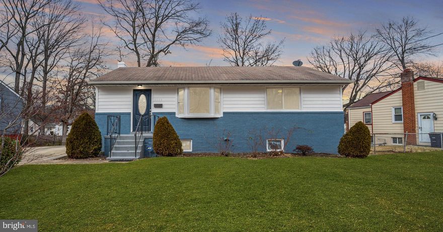 Welcome to this newly revitalized rambler with full basement apartment in Seabrook Park Estates boasting 4 bedrooms, 2 full baths, 1,824 total square feet, and NO HOA! Be wowed by the lustrous blue door as you pull up in the extended driveway that can fit 2-4 cars. Step into the open concept living room with gleaming dark hardwood floors, recessed lighting, and an oversized bay window.  Enter the gourmet kitchen with quartz countertops, gray 42" cabinets that frame the ceiling and are accentuated with upgraded chrome hardware, cushion close drawers, and lots of storage and counter space.   To add to the flavor, the stainless-steel appliances include a gas, grill-top stove, programable dishwasher, 3-door refrigerator with ice maker, and a built-in, above range microwave.  The remainder of the main level has three bedrooms with a ceiling fan in each, and a full bathroom with bathtub, rain shower, and vanity with upgraded hardware for couture. Head downstairs from the kitchen stairwell to find an in-law suite or CASH FLOW OPPORTUNITY IN BASEMENT, an additional bedroom, a full bathroom with spacious shower, two large common area spaces, one with a cozy brick wall fireplace, laundry corridor, and a wet bar or FULL KITCHEN (just add the stove) with sufficient cabinet space.  The basement has both a rear and side entry.  The home sits on a generous lot with fenced backyard which has a new shed for storing items to maintain the landscaping.   Close to schools, shopping and is a reasonable commute to Washington, DC, this home is a beauty in a great location! All you need to do is move right in. This space will make a happy home for years to come! Let's make it yours!