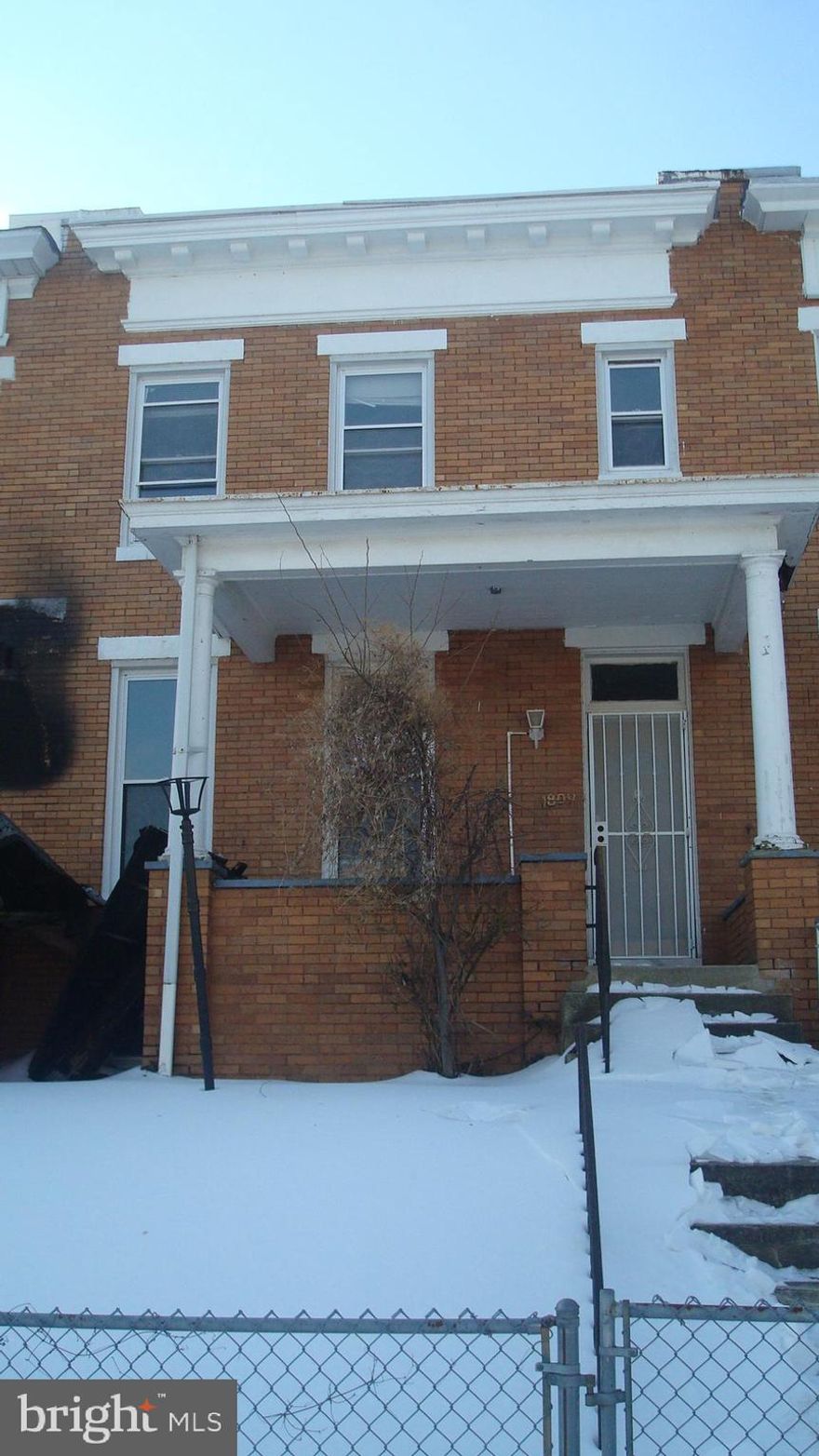 Lake Montebello over here on the east side and take note my friends, this one has a covered front porch facing north which will allow a sunrise and a sunset while you are sipping your tea or drinking your wine. We’re bringing you this opportunity of a classic interior, porch front, all brick Baltimore style townhome. That classic old world traditional construction with hardwood inlaid floors, a real foyer and handcrafted all wood staircase leading to three massive bedrooms with enormous bright windows. On the main level, you have a formal dining room and oversize living room. Another half bath in the basement and check out the rear yard with an oversized, all brick, detached garage accessible via an extra wide concrete paved alley. Hit the golf course over at Clifton Park, take a bike ride around Lake Montebello or a hike through Herring Run Park. You’re close to Lauraville, Charles Village and even Johns Hopkins University. Think about it, this immediate location is convenient to nearly everything north and east of downtown Baltimore. This one is ready for your treatment. Buyer to verify if ground rent exists, seller will not redeem.