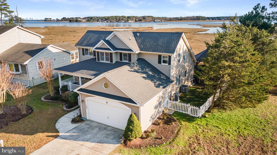 Welcome to this exquisite 5-bedroom, 3 full-bath home nestled in the heart of Ocean Pines, where breathtaking water views will leave you awe-struck. This stunning property boasts an unrivaled vista of the enchanting Ocean City Skyline, ensuring you'll be captivated by its beauty day and night. A few of the homes’ recent upgrades include a new roof and shutters, luxury vinyl plank throughout, new vanities, and it was freshly painted including the trim and doors. With ample counter space, this kitchen is perfect for creating gourmet meals while soaking in the picturesque scene. This home has 2 first-floor bedrooms, which include one of the primary suites. The living room has a vaulted ceiling, a fireplace, and large windows overlooking the amazing view. The second level has the large second primary suite with a fireplace and vaulted ceilings, or this space would make an amazing family room. Situated just moments away from the delightful beaches of both MD and DE, this home offers the ultimate coastal living experience. A haven for those seeking solace in nature, you'll be mesmerized by the tranquil surroundings. Indulge in outdoor living at its finest as you retreat to the screened-in gazebo, where you can delight in the gentle sway of the tides while savoring a refreshing drink. Imagine hosting unforgettable gatherings here, surrounded by the serenity of the water. Seek refuge from the ordinary in the remarkable amenities that Ocean Pines offers. With access to both indoor and outdoor pools, you can dive into relaxation or enjoy a refreshing swim no matter the season. The clubhouse provides an avenue for socializing, while the nearby golf course will entice even the most seasoned players. A dog park ensures that your furry friends will also feel at home in this picturesque community. And when it's time for a nautical adventure, the easily accessible boat ramp or marina allows for seamless exploration of the coast, making every day a boater's paradise. With its prime location and mesmerizing surroundings, this home truly offers living at its finest. Don't miss out on the opportunity to experience the coastal lifestyle you've always dreamed of. Act now and make this enchanting oasis your own.