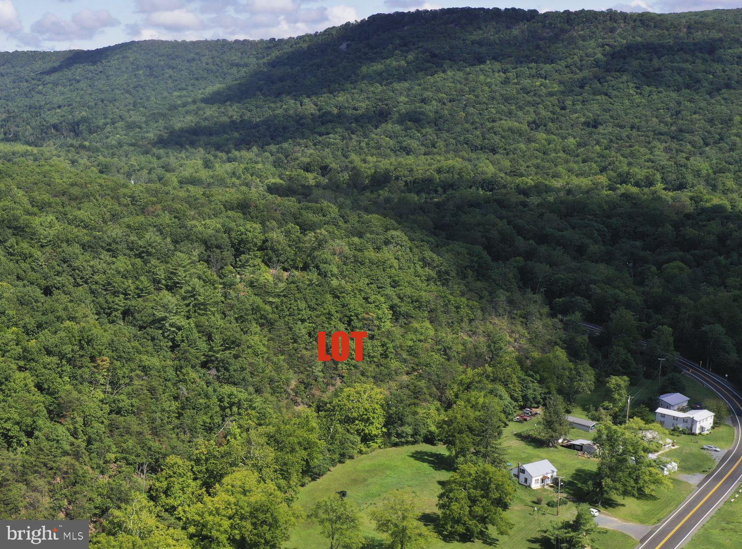 WELCOME TO WILD, WONDERFUL AND WATERFRONT! PRIVATE 5.861-ACRE WOODED BUILDING LOT ALONG NORTH RIVER. Price reduced! One hour from Winchester, Virginia, near the town of Rio. Great location for camping, weekend getaways or building that cabin or rustic retreat that you've always dreamed of. The river is trout stocked. This lot offers 300+ feet of river frontage with gentle water falls. Mature hardwoods throughout. Build your house or cabin at the front top of the lot and add a stair case through the rear of the lot down to the river. Affordable and a great value! Already improved by a 400-foot driveway and a newly installed well. Permit approved for a 3-bedroom, 1,000+ gallon septic. On a cul-de-sac in Rio Hill, a small subdivision with minor covenants including annual road maintenance fee of $25.