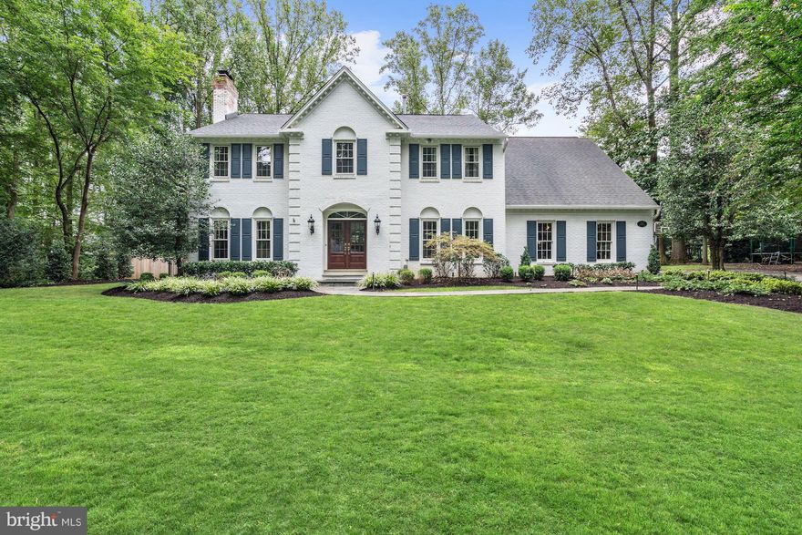 Impeccable brick 5,400 SF colonial privately sited on a cul de sac with acres of parkland w/walking paths along streams & bridges to Spring Hill Rec Center. Beautifully renovated & updated with the finest materials and designer appointments throughout. Gourmet kitchen, 9 ft ceilings, 3 fireplaces, luxury master suite and thoughtfully designed lower level w/ media center, wine bar, & gas FP.