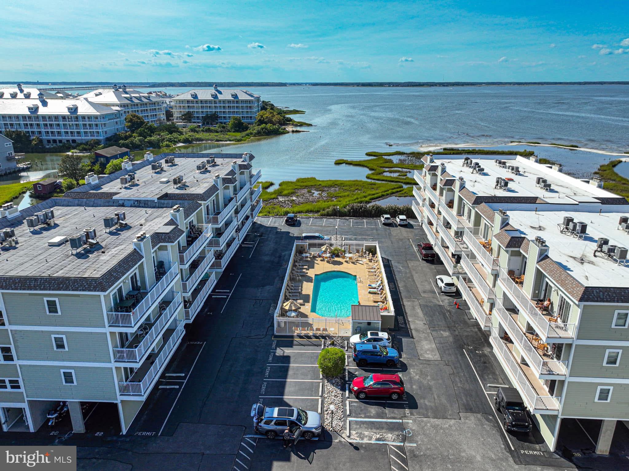 Discover the perfect coastal retreat in this stunning end unit condo, which rarely becomes available! This fully furnished gem boasts bay views from your spacious balcony, making it an ideal spot for relaxation and enjoyment. Conveniently located in a tranquil mid-town community, this property offers a harmonious blend of comfort and leisure.
Step inside to find a stylish and functional kitchen with ample countertop space, perfect for culinary enthusiasts. The open concept layout creates an inviting atmosphere, seamlessly connecting the eat-in area to the cozy living room. Enjoy the privacy of separated bedrooms, both of which provide direct access to the expansive balcony.
Emphasizing a calming coastal vibe throughout, this condo is designed for ultimate relaxation. Additional perks include a washer and dryer, two parking spaces—one assigned under the building—and plenty of off-street parking. An elevator adds to the convenience of this well-maintained building.
Take a leisurely stroll to the beach, unwind by the pool, or explore nearby restaurants, shops, and entertainment options. This is a rare opportunity that won’t last long—don't miss your chance to make this coastal paradise your own!