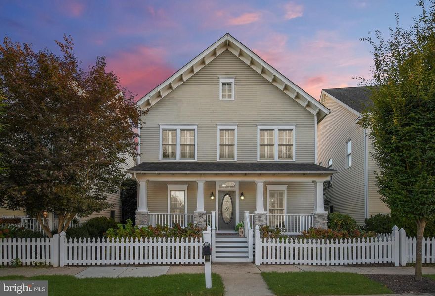 This lovely home in the Villages of Urbana has it all--including a white picket fence! Relax with your morning coffee on the spacious front porch or enjoy an evening beverage on the deck, balcony, or patio. And the location doesn't get any better than this--situated on a quiet street across from several great neighborhood amenities-- including playgrounds, tennis and basketball courts, a community center, and one of the community pools. You will love the floorplan and amenities of this four-bedroom home. With well-thought-out spaces throughout--the main level features a formal living room, office/library, dining room, and open floor plan gourmet kitchen and family room. Upgrades galore throughout the home including plantation shutters, gleaming hardwood floors, a beautiful stacked stone floor-to-ceiling fireplace in the family room, moldings, granite, and stainless appliances in the gourmet kitchen. The luxe owner's suite features a scenic balcony, spacious walk-in closet, and upgraded bath with separate dual vanities, a walk-in shower, and a soaking tub. Enjoy the convenience of the second-floor laundry area. The finished lower level features a full bath, storage area, and spacious recreation and living areas. Don't miss your opportunity to live in the Villages of Urbana--with its sought-after amenities, including two pools (including the resort-style pool with a lazy river), work-out facility, and Village Marketplace with restaurants, grocery, and library!