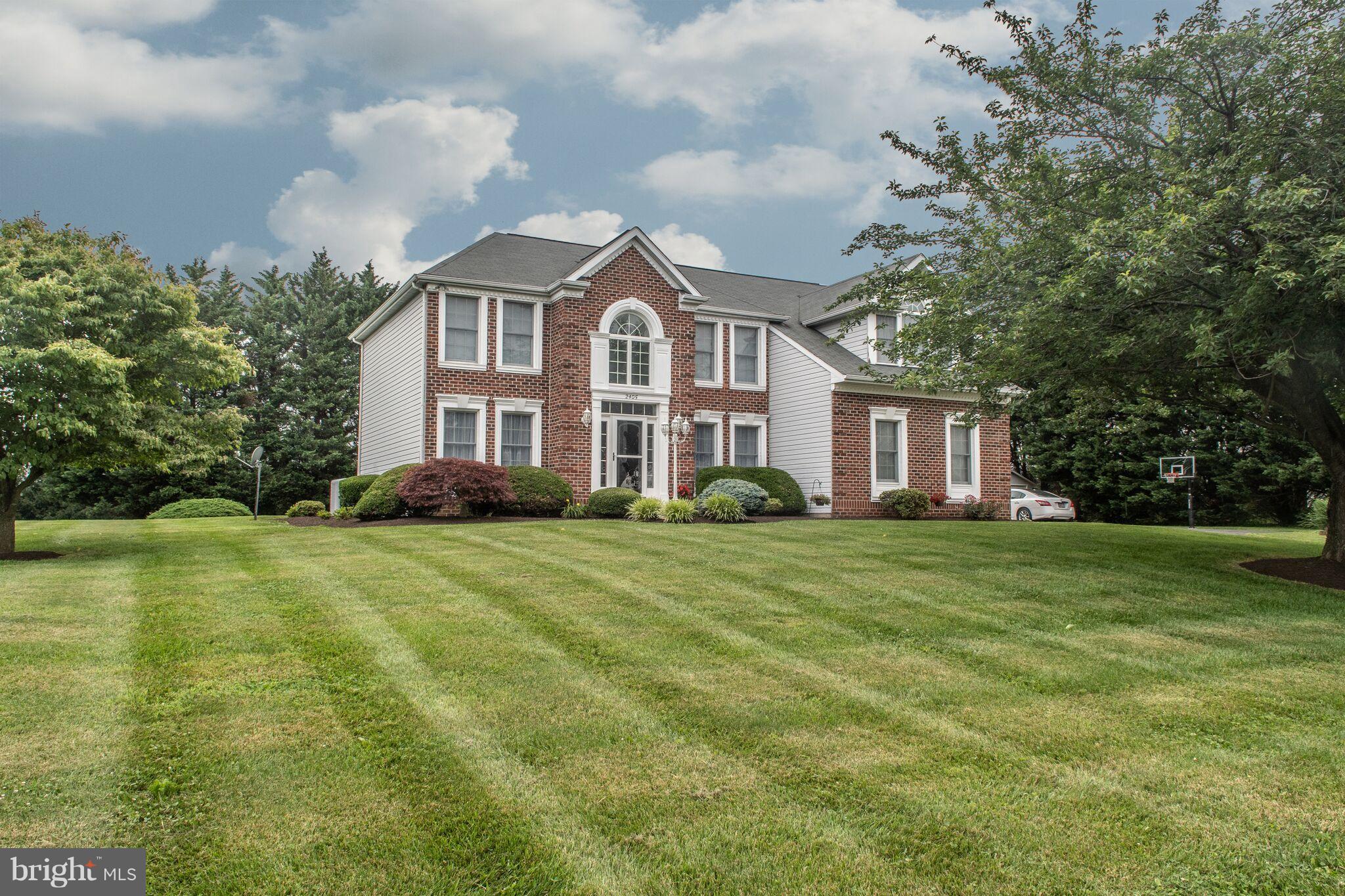 Lovely brick front colonial with 2 car side load garage situated on almost 2 acres in beautiful Edwards Manor. Great floor plan with 1st floor office, den or playroom (currently used as guest room), family room with floor to ceiling brick fireplace, beautiful kitchen w/granite counter tops, spacious bedrooms, lots of closet space and finished basement with theater room. Beautiful property!