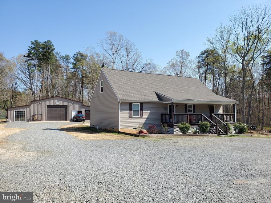 New Price!! Newly built Cape Cod, larger than what tax records states (tax records not showing finished top floor).  Large flat 2.2 acre lot.  Inside of the home there is the spacious open kitchen with stainless steel appliances and plenty of cabinet space.  Two bedrooms and full bathroom on the main level, with an additional large room that can be used as a man cave or in-law suite.  Upstairs you will find the master bedroom and master bathroom with plenty of privacy.  Upstairs also has a spacious loft that would be perfect for an in-home office!  Outside you can sip coffee on your covered front porch or back deck.  Last but definitely not least is the over-sized garage / workshop, must see to appreciate the size!