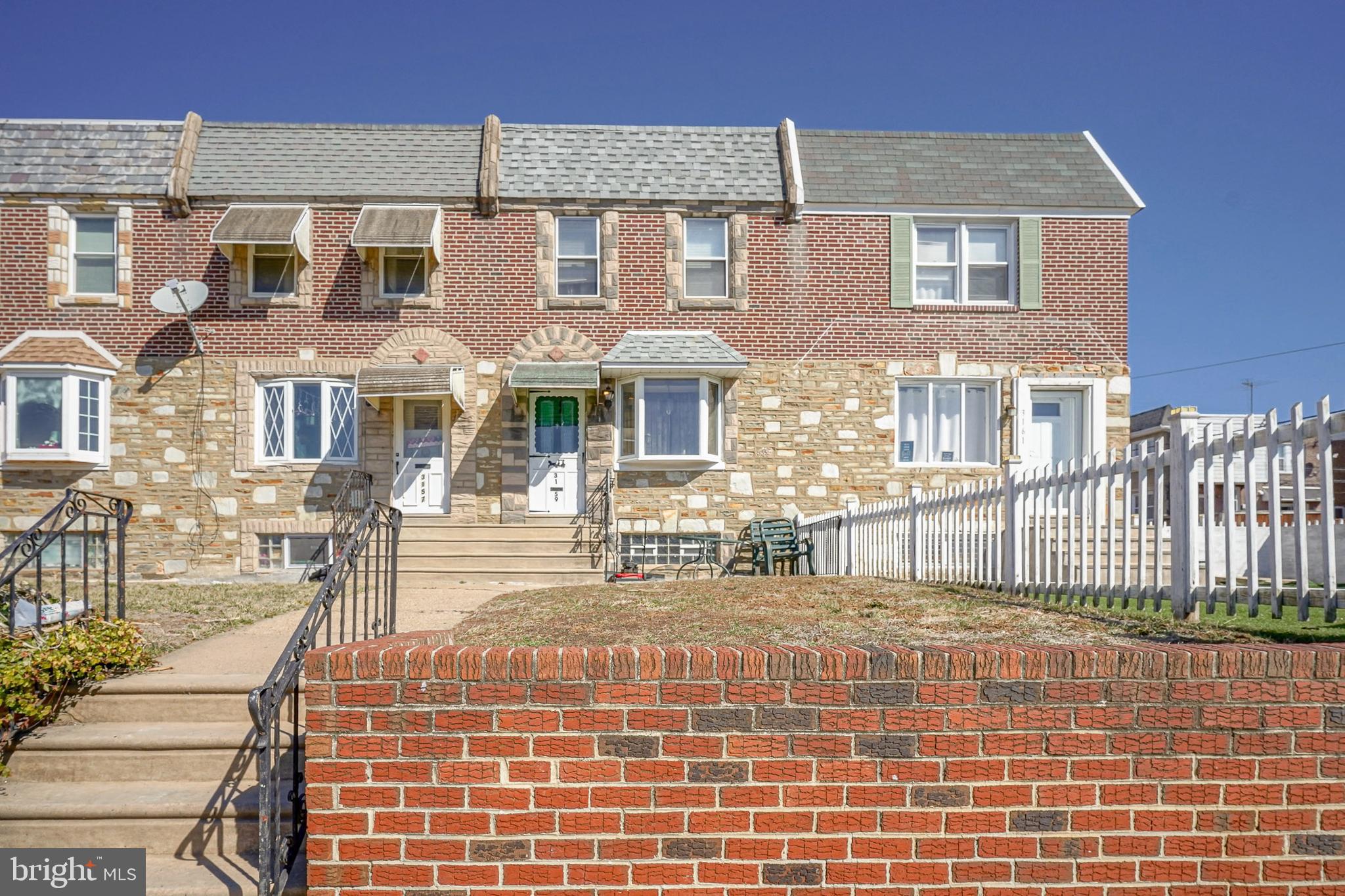 Nicely maintained brick and stone front airlite with a rear deck that is situated on a quiet block in the desirable West Mayfair section of Northeast Philadelphia! Arrive and you will immediately picture yourself relaxing on your front patio. Enter to find fresh paint and newer carpeting throughout. The main level offers a large living room with bay window that provides an abundance of natural light and leads to the formal dining room with nice ceiling fan and open concept to the kitchen with a ton of cabinets and counter space, stainless steel appliances that include a gas range and refrigerator with water and ice dispenser that is included. The kitchen also provides access to the covered rear concrete deck, which is great for warm weather entertaining. The upper-level hosts 3 spacious bedrooms, all with newer carpets, ceiling fans and plenty of closet space and a 3-piece ceramic tiled bathroom with shower/soaking tub combo with nicely tiled surround. The lower level is a fully finished basement that would make a great family room with a powder room and has a separate laundry room and exits to the attached garage and driveway that provides covered parking. Additional features include a newer heater and water heater, updated electric service and panel, replacement windows throughout, newer roof and the list could go on. Conveniently located within walking distance to several public, private and charter schools, a thriving commercial corridor with many restaurants and amenities, parks and recreation centers and supermarkets. A variety of public transportation options and I-95, Route 1 and the bridges to NJ are all in close proximity. Will not disappoint!
