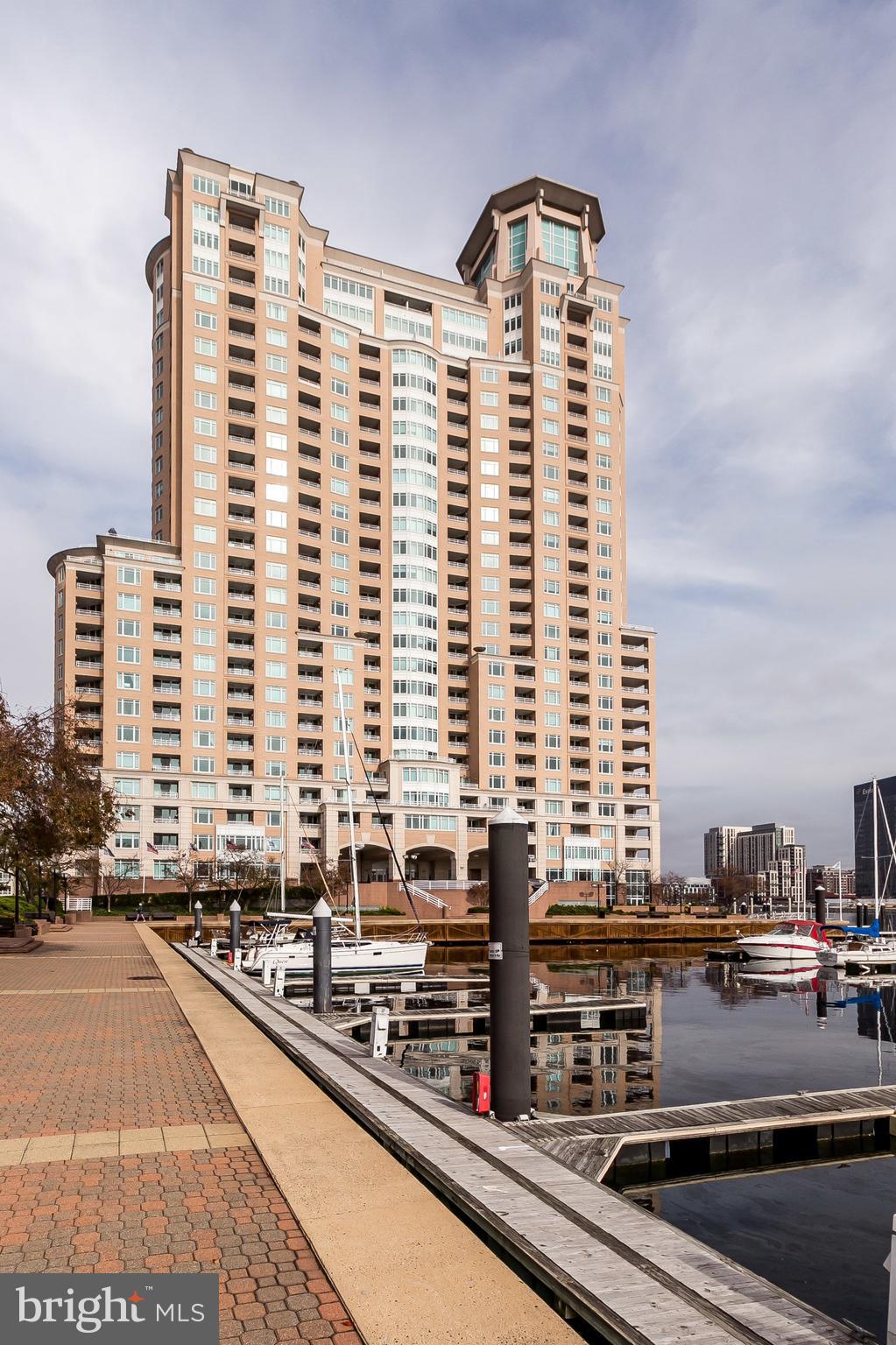 Spectacular AWESOME city and water views! Clean, bright apartment with luxury vinyl flooring offers open LR/kitchen floor plan with 2 balconies! Highlights include 1,129 sf, stainless appliances, lots of counter top cupboard and pantry space, lots of light, decorative pendants and recessed lighting, W/D. Main Suite offers walk-in closet, private bath with dual bowl sinks, shower, Jacuzzi tub. Den (2nd BR) with private 2nd balcony. Rent includes gated garage parking, water, extensive fitness center with steam, sauna, pools, hot tub. Outdoor grill area! Luxury full service building with many value added amenities and services! 24/7 front desk concierge and valet, billiards, dining rooms, lobby social lounge with Internet access, conference rooms, guest suites, business center! Harborview Marina & Yacht Club grounds are beautifully landscaped with walking/jogging paths, seasonal flowers, water fountains. On-site gourmet deli, patio dining, banking, security staff, and plenty of guest parking! Close to night life, shops, stadiums, business district, free public transportation, MARC train and 10 miles to the Airport! Available soon!