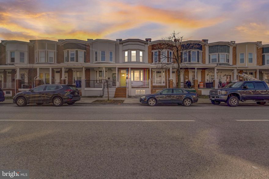 Presenting 425 E 28th Street. This 4 bedroom 2.5 bath awaits you. Spacious floor plan with flowing hardwoods, gourmet kitchen with granite counters and stainless appliances, exposed brick walls, finished basement,,  large front porch, and rear deck to relax and enjoy some fresh air.