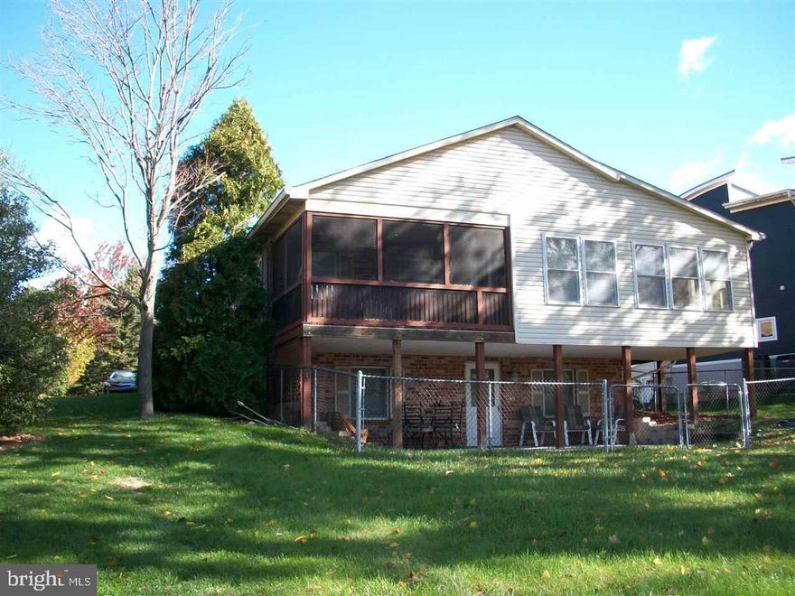 WONDERFUL NEARLY 1800 SQ FT HOME ON THE LAKE.. THIS HOME HAS 4 BEDROOMS 3 FULL BATHS.  LARGE FAMILY ROOM DOWNSTAIRS OPENING TO THE LAKE. INITIATION FEES $4200 AND YEARLY FEES $1069.  THIS INCLUDES USE OF POOL AND OTHER FACILITIES.