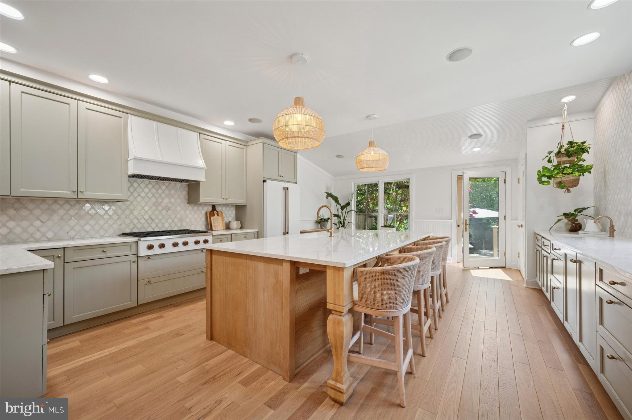 Welcome to 234 Benezet Street — a rarely offered 4 bed, 2.5 bath home where the timeless charm of Chestnut Hill meets the desired upgrades of today. Situated on a one way street, entrance to 234 is through the original covered front porch, offering a hospitable landing space perfect for a glass of wine or a place to leave your stroller. Inside, brand new (and level!) white oak hardwood floors flow from the bright living room through a formal dining room providing both an open feeling while also providing dedicated space for entertaining and hosting. The heart of the home is further back, and visitors will be delighted by the fully updated, expansive eat-in kitchen. Sure to satisfy the cook in your family, the center of the kitchen is a massive handmade white oak island, surrounded by custom cabinetry, Café appliances (including a touchscreen oven), Carrera marble backsplash, and discreet under-cabinet lighting with hidden outlets. A whole-house water filtration system and reverse osmosis tap provide fresh, filtered water right at the sink. Filled with light and endless storage, the kitchen has room for a dining table and is completed with a half bathroom.
The second level offers two bedrooms and a full bath with an extra stackable laundry for added convenience. The third floor has two additional bedrooms and a renovated full bath featuring white Thassos marble and a deep soaking tub. Comfort is year-round with central air for the main floors and mini-splits on the third, plus built-in flush-mount vents for a sleek look.
The basement offers even more storage and another laundry area. Outside, a huge backyard boasts an automatic sprinkler system and a shed with electric — perfect for hobbies, storage, or a workshop. Updated wiring, built-in kitchen speakers, and high-end finishes at every turn make this home as functional as it is beautiful.