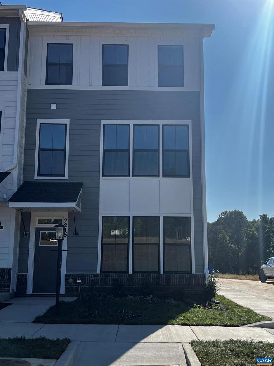 Still new end unit townhome just minutes from UVA, downtown and Wegman's shopping center.  This spacious beautiful upgraded townhome is available with short notice and shows like new.  Large island kitchen with quartz countertops, white cabinets and pantry.  Luxury vinyl plank flooring throughout main level.  Large living space with lots of natural light.  Upper level features spacious primary bedroom with private bath;  2 additional bedrooms and full bath; washer and dryer provided. Terrace level features additional bedroom, full bath and 2 car garage.  Each tenant pays 1/3 of utilities.