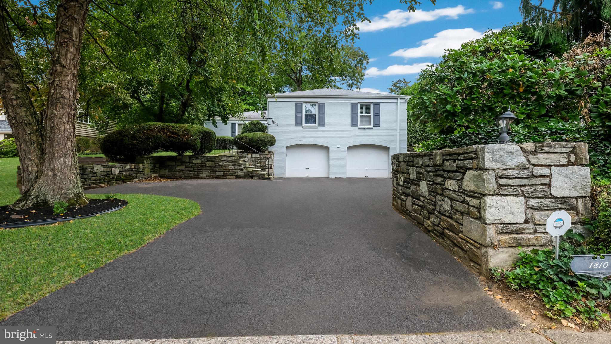 Lovely 4 BR, 3.5 BA Raised Ranch in Baederwood! Stone steps lead to the covered front entry that opens into a welcoming and spacious Foyer with slate tile floor. Bright and airy Family room with wall-to-wall carpet & marble wood-burning fireplace with built-in bookshelves flanking either side. Formal Dining room with parquet wood floor & French doors leading to a covered patio overlooking the yard. Eat-in Kitchen with Corian and Butcher block countertops, pantry with built-in shelving & stainless steel appliances including gas range, built-in microwave & dishwasher. Primary BR w/ wall-to-wall carpet, loads of closet space & full bath with ceramic tiled floor & walls, walk-in shower with sliding glass door & double vanity. 2nd BR with wall-to-wall-carpet, dumb waiter to the Basement & ensuite bath with ceramic tiled floor & walls, stall shower & pedestal sink. 3rd & 4th BR's offer hardwood floors. The 4th BR features built-in shelving & speakers. Full hall bath with ceramic tile floor & walls, and tub/shower combination. Full, finished Basement offers wall-to-wall carpet, recessed lighting, built-in shelving plus a separate Laundry/Utility room, workshop, half bath, cedar lined storage closet & access to the 2-car attached Garage. . This home offers a private yard with mature trees in a great neighborhood. Close to shopping, major roads & transportation. Don't miss this one!
