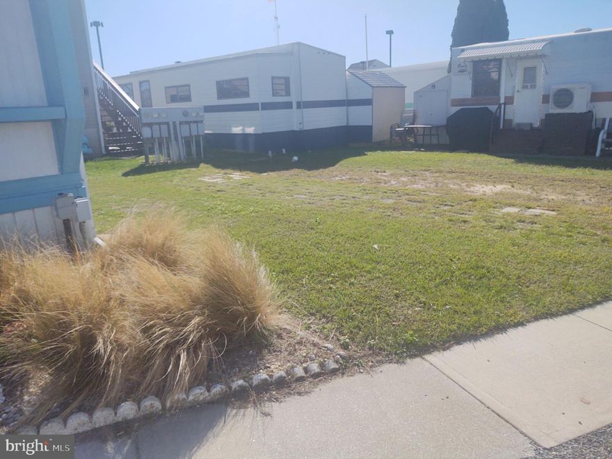 What an Opportunity! Capture this Vacant Lot - high and dry -  in the heart of Ocean City in Warrens Park - a Bay side Waterfront Community.  Ownership of this lot comes with  1500 shares of Warrens Park, Inc.  Note your low monthly cost of $129....COVERS THE FOLLOWING:  Your Real Estate Property Taxes!  Your Public Water and Sewer Fees!  Also covers Management and Maintenance of Roads, Bulkhead, Private Boat  Ramp, Fish Cleaning Table/area with Running Water!  Plus covers two smaller common area Piers with steps into the water for swimming, fishing, crab pots, clamming and lots more.  There is also an on-site storage area to store your boat and trailer plus slips to rent and purchase as they become available.  Bring your floaters, kayaks, paddle boards, and have  fun.  Again, lot ownership and all of the above for only $129./month.
Where else in Ocean City can your ownership  of this lot cover so much.  And as an extra bonus, you are right here to enjoy OC's Spectacular Sunsets plus being across the street from The Beach!  It's like having the best of both  worlds.  Will this be your beach "get-away"... Interested?  Inquire about more info on hand regarding the placement of a two bedroom/ one bath cottage like mobile home approved at this time for this lot.  
Don't wait - call today and check out this fabulous location.