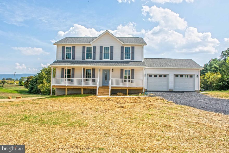 AGENTS: PLEASE SEE property documents attached for  lot clarification. Almost new Colonial (Completed  and photographed in 2019) nicely situated  and landscaped on level 1+ acre lot with amazing mountain views! Just 2 miles from Woodstock makes this well built home a great commuter location! Two car garage, custom rear deck and covered front porch make this a great place to call home! Main level boasts beautiful wood laminate flooring, formal living room, formal dining room, spacious great room that is open to a beautiful gourmet kitchen with large island, granite counters, white cabinets and SS GE appliances. The custom rear deck can be accessed from the kitchen/family room area to enjoy your morning coffee and evening dinners!  Upper level has large master suite with full bath and large walk in closet. 2nd and 3rd bedrooms are spacious with large closets and a large separate laundry room with a pantry/storage closet.  Full walkout level unfinished basement with windows just waiting for your finishing touches which could increase your square footage to over 3,200! Public Water and 3 BR fast drip septic system. **Agent/Owner** Currently occupied. Photos are from a year ago at the completion of construction.  Tenant occupied but VERY easy to show! Tenants have taken excellent care of the home and it shows well!