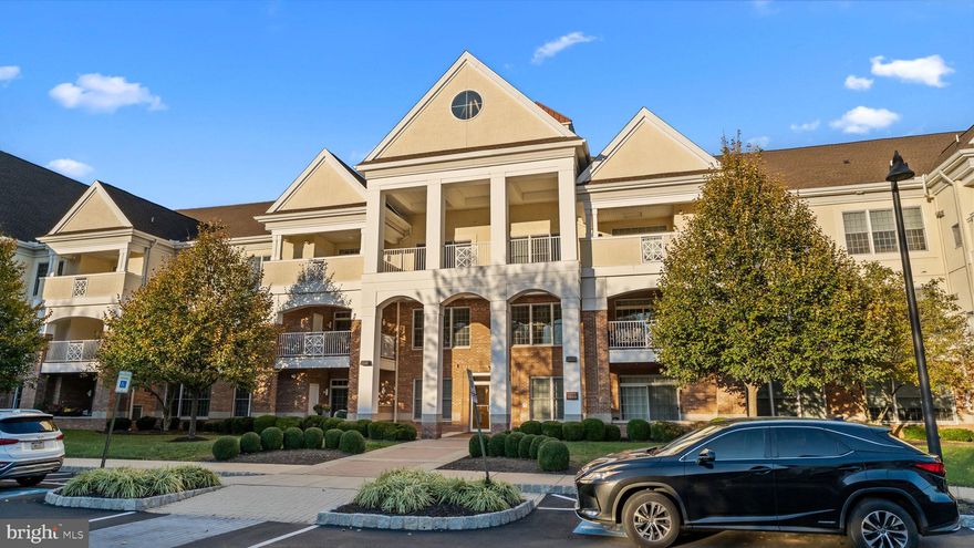 Welcome to this exquisite 2-bedroom, 2-bathroom Penthouse residence in one of the newest buildings at the highly sought-after Meridian of Valley Square, a premier 55+ community in the heart of Bucks County. A welcoming foyer introduces the spacious, light-filled interior, where the open dining and living rooms showcase gleaming hardwood floors, a wet bar, a charming corner electric fireplace and sliding glass doors that open to a private balcony overlooking the serene wood lined retreat. The gourmet kitchen is a chef’s delight, featuring top-of-the-line stainless steel appliances, including a gas cooktop, custom cabinetry, elegant countertops, a casual dining  island with seating . The luxurious primary suite offers a tranquil retreat, a sunlit sitting area framed by a double window, an expansive walk-in closet, and two additional closets for ample storage. The spa-inspired en suite bath is beautifully appointed with a dual vanity, a custom walk-in shower with seating, and a dressing table. The second bedroom, privately situated on the opposite side of the home, makes for the perfect guest suite with plenty of light, a walk-in closet, and an additional large closet. An adjacent full bathroom and a conveniently located laundry room—complete with full-size stackable washer and dryer. This penthouse includes a private full-size garage with interior access, as well as a nearby dedicated storage unit. The Meridian lifestyle is unparalleled, offering secure entry, elevators, walking and jogging trails, a saltwater pool, and a clubhouse with a billiard room, fitness center, library, and more. Perfectly located within walking distance to Wegmans and the shops and dining of Valley Square, with easy access to major commuting routes and just minutes from historic Doylestown Borough, this penthouse is a rare offering in one of Bucks County’s most desirable communities