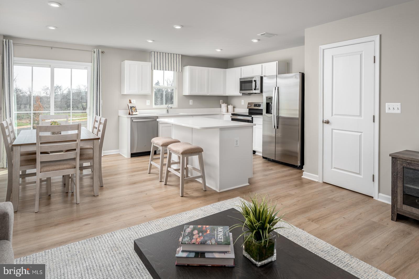 This is the QUICK MOVE IN Poplar floorplan at the Cardinal Pointe community! This stunning, brand new 3 bedroom 2.5 bath townhome boasts an open floorplan, a spacious kitchen island, LVP flooring, stainless steel appliances, white cabinetry, a beautiful backyard, and is an END UNIT! The wide-open great room flows seamlessly into the gourmet kitchen and light-filled dining area, where the kitchen island provides extra storage and counter space. Upstairs, find two generous secondary bedrooms and a full bath. The conveniently placed laundry room is on the same level as the bedrooms and includes your washer/dryer. The owner's suite includes a dual vanity bath and enormous walk-in closet. Don't let The Poplar pass you by! The community is only a mile from the Spring Mills shopping center for all of your daily conveniences. 15 minutes to Hagerstown, 30 minutes to both Frederick, MD and Winchester, VA and easy access to major highways and public transportation. The newest county school campus is just a mile away! Don't miss your chance to own a piece of this beautiful community. Contact us today for a private tour. Photos are representative.