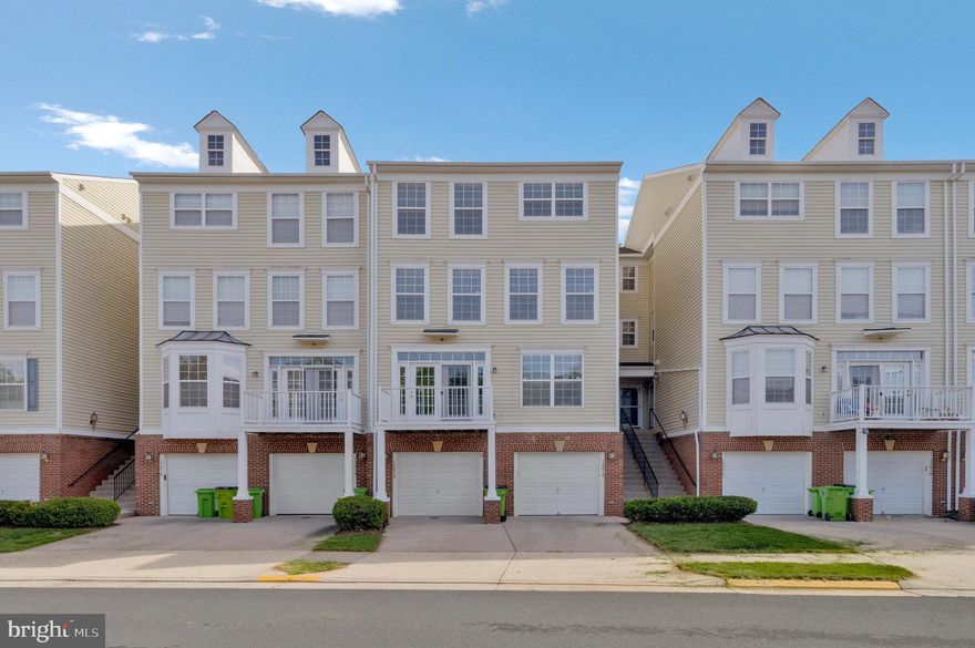 Welcome to 13614 Salk Street, a thoughtfully updated 3 bedroom, 2.5 bath townhome style condo in the desirable Coppermine Crossing community of Herndon, VA. Warm light greets you as you enter this open concept main level, offering spacious living and dining areas, perfect for entertaining or relaxing. Easily create your perfect meal in the gourmet kitchen, featuring new stainless steel appliances, ample cabinet space, solid counters, pantry, and separate eating area. The top floor master suite boasts a vaulted ceiling, a generous walk-in closet, conveniently located new full sized washer and dryer, and a huge luxurious en-suite bathroom with a soaking tub, separate shower, and dual vanities.  The second level features two spacious bedrooms, linen closet and full bath. The lowest level highlights a one car garage with storage, additional driveway parking, and ample guest parking closeby. This home is move-in-ready with fresh paint throughout and new carpeting in the bedrooms. Situated just minutes from major roadways (VA-267, VA-28), Dulles International Airport, and walking distance to the Innovation Center Metro Station (Silver Line), this home offers unparalleled convenience. Enjoy community walking paths, shopping, dining, and recreational options in close proximity, making this home the perfect blend of comfort and location.