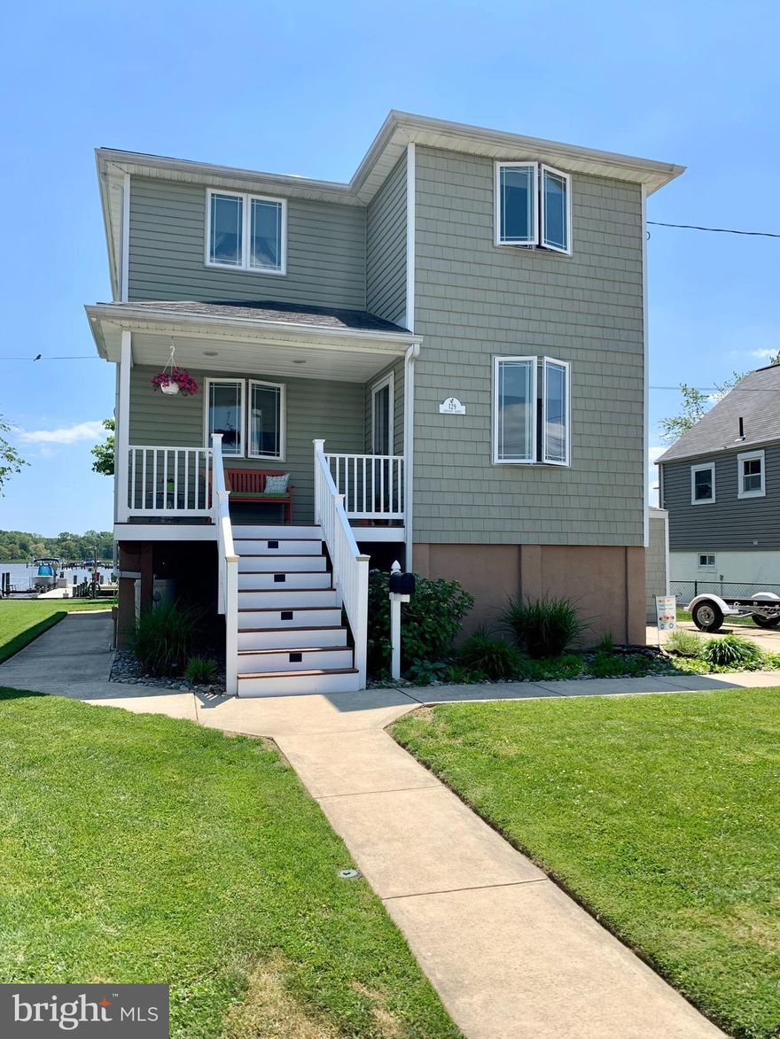 WATERFRONT LIVING AT IT'S BEST!! 3 Bedrooms 2 Full Baths & 2- 1/2 Bath's!  Total rebuild! Amazing location, Deep Protected Water, 2 Boat Lifts, 1 Jet Ski Lift 88' of Water-frontage!   See the pics! These pics don't lie! Totally TURNKEY!! Start YOUR summer off right! Open design Large Island Kitchen / Dining combo (under cabinet lighting) with a bonus sitting room with Million $ Views!  Powder Room and Pantry, Living Room on the roadside of the house. Waterside Master Bedroom has Amazing Views, En Suite Bath and Private Balcony, you won't want to leave! Laundry just outside the Master! 2 more Bedrooms and Full Bath on upper level. Lower level is set up for entertaining Large Recreation Room, 1/2 Bath and a Large work room.  Outdoor Kitchen set up, Raised Deck (Designed to NOT interfere with the Water Views from the main level!) Hot Tub (As-Is), Built in mini Bar, Separate Sun Pad, Large Shed with power AND a Generator Hookup (conveys). This home  is very well thought out, and was built as their forever home... But turns out... Grandkids Rule!  lol  OPPORTUNITY IS KNOCKING!!  WILL NOT LAST!!