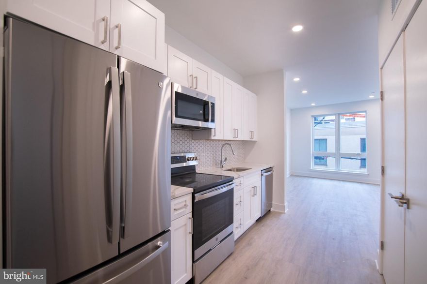 Available NOW!

Welcome to 1325 N Lee Street! Located in the trendy Fishtown neighborhood of Philadelphia this beautiful brand new apartment community is the latest addition to the fast growing corridor along Frankford Ave/Front Street and features 20 luxury apartment homes along with first floor commercial space. All units showcase design driven high end finishes, abundant space and access to excellent communal amenities – as well as Central Air/Heat and In-Unit Washers/Dryers. Upon entering any of the apartment homes you are welcomed with an abundance of natural light flowing through large windows in the open-concept kitchen, living space and bedrooms. Kitchens are equipped with plenty of countertop and cabinet space, modern tile backsplashes, stainless steel appliances, and gorgeous hardwood flooring throughout. Generous living areas host large windows and plenty of space for your furniture or home office space. Bedrooms will comfortably fit a queen sized bed and offer plentiful closet space! The stunning bathroom spaces feature designer tile in the tub/shower combos beautifully accenting the finishes throughout this space. Finally, on top of it all, the building also offers a spacious communal roof deck with a sweeping view reaching all the way to the center city skyline! Conveniently located close to everything Fishtown has to offer, including the Market-Frankford Subway, Area Highways, & tons of local hop cafe’s, restaurants, and breweries. The famous Pizzeria Beddia is even just across the street!  Don’t miss your opportunity to be a part of this exceptional apartment community. Schedule a tour with our agents today and discover your new haven in Fishtown!

Lease Terms: Generally, 1st month, and 1 month security deposit due at, or prior to, lease signing. Other terms may be required by Landlord such as last month’s rent upfront. $65 application fee per applicant. electricity, gas (if applicable), cable/internet and $10/mo technology fee. Water is a flat monthly fee of $60. $25 service fee plus cost of the air filter will be charged quarterly for routine air filter replacement.  Landlord Requirements: Applicants to make 3x the monthly rent in verifiable gross income, credit history to be considered, no evictions within the past 5 years, and must have a verifiable rental history with on-time rental payments. Exceptions to this criteria may exist under the law and will be considered. Cosigners will be considered.

*Price reflects the net effective rent after a 6-week credit is applied at $1,450/mo.
*Dogs under 35lbs permitted with owner approval. $50/mo pet rent required. No Cats.
*Photos of multiple units in the building. Finishes will match, layouts may vary.