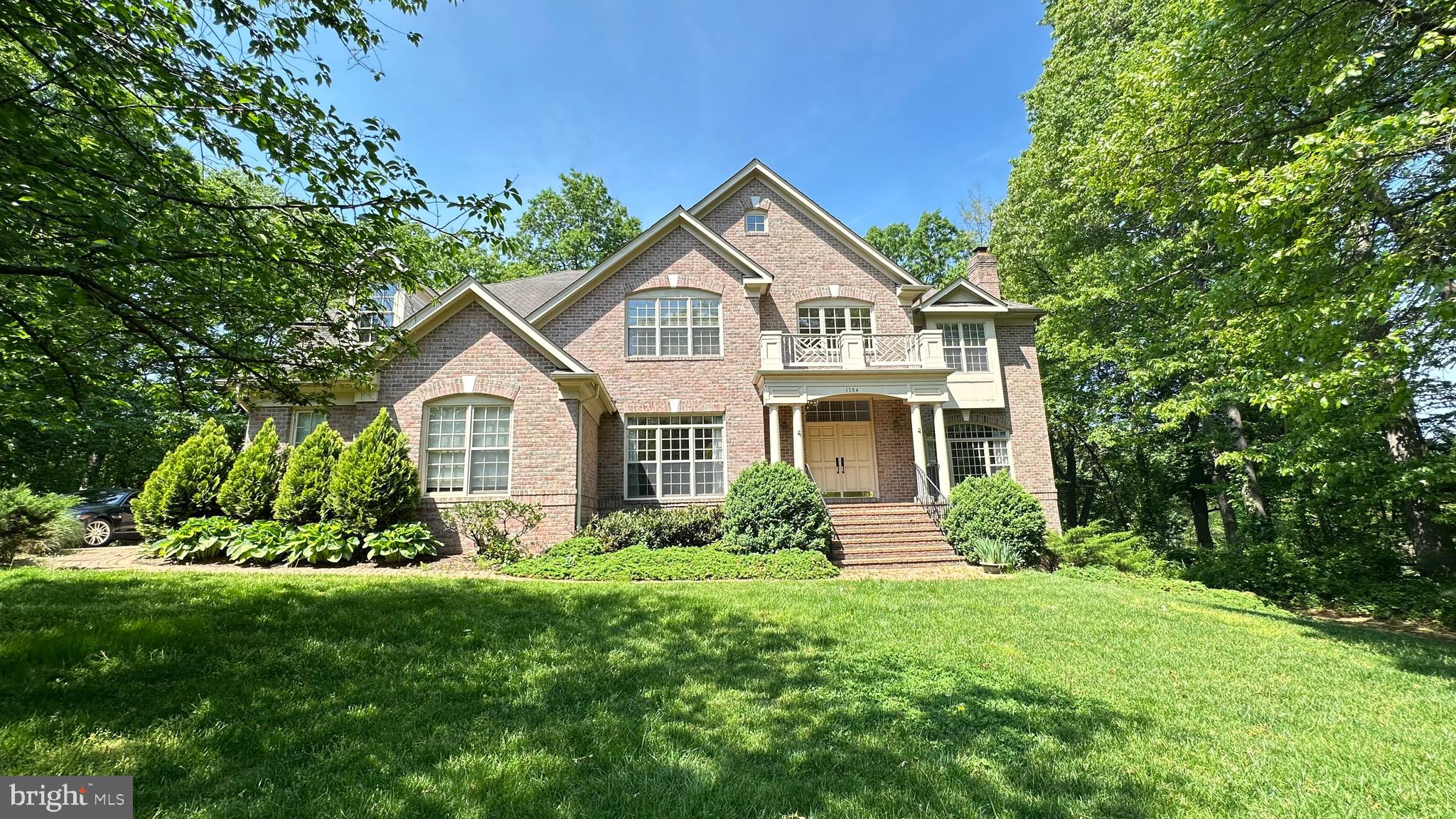 Beautiful sun-filled colonial built by GP Homes, tucked away on a quiet cul-de-sac just minutes from Tysons, the Toll Road, and the Beltway. Situated on a generous 0.83-acre lot, this spacious home offers 6 bedrooms, 5 full baths & 2 half baths! Features include a dramatic two-story foyer, a stunning two-story family room with soaring ceilings, and a gourmet kitchen with breakfast bar that opens to a large deck. The grand primary suite includes a sitting area and fireplace. The expansive walk-out lower level features a rec room, two bedrooms, two full baths, a den, exercise room, and ample storage. Three-car garage. Perfect for luxurious family living and entertaining!