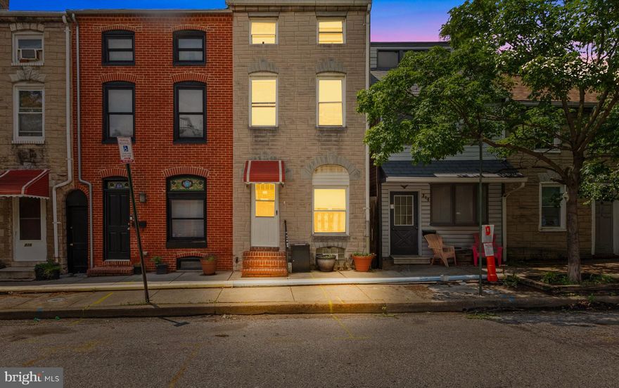 Welcome Home to this VERY spacious and functional Fells Point end unit. With 4 finished levels, over 2000 sqft of finished living space, and a very large rear patio, this home has lots to love and room to grow!  This block of Wolfe St has parking on both sides of the street! Attractive LVP flooring on the main and upper levels, stainless steel appliances in the spacious kitchen, convenient half bath on the main level, very large outdoor patio off of the main level for entertaining with bonus breezeway/storage area, 1 large bedroom and full bathroom on the 2nd level, 2 full bedrooms on the 3rd floor, and a functional finished basement with plenty of additional storage. System updates include new sump pump 2024, recently replaced HVAC, owned solar array on roof, water filtration system in basement, central heat & A/C.  Walkable alleyway with gate on the side of the home. Current owner has a dedicated handicap parking space directly in front of the home.