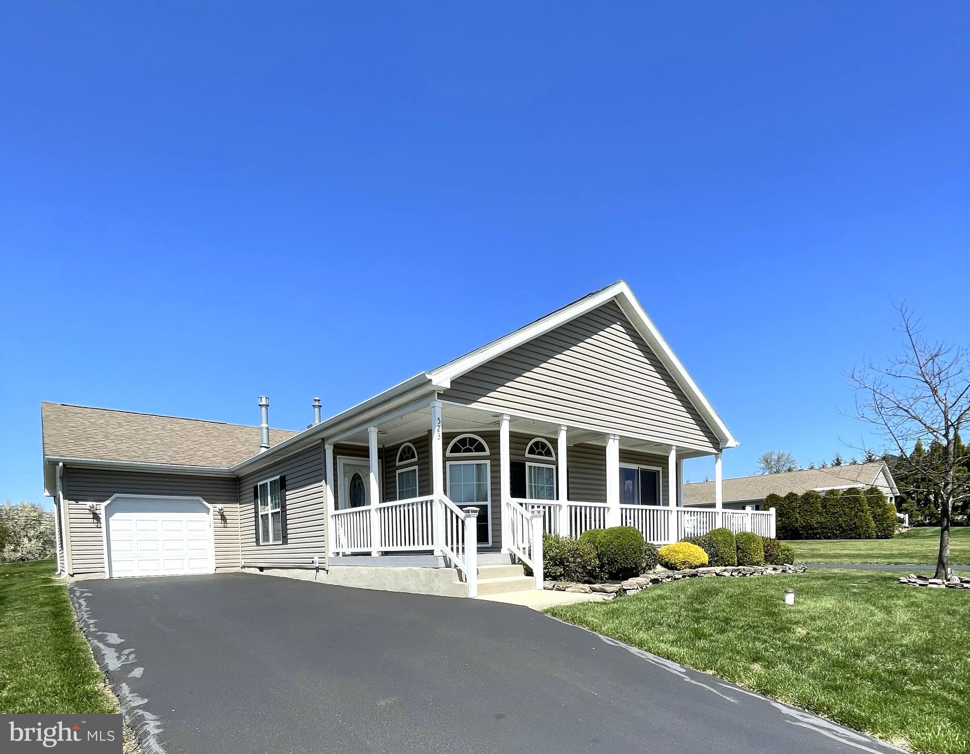 Move right into this lovely Berkshire model ranch style home, located in the heart of the community with a side deck, overlooking open space for added privacy. This popular model features 2 bedrooms, 2 full bathrooms plus a den. The kitchen is spacious with an island, upgraded wooden cabinets, granite countertops and sliding doors to a beautiful deck that wraps around the front of the home for covered “porch sitting”. The custom designed open floor plan allows flexible use of the kitchen and dining areas. There is an attached, oversized, insulated garage with plenty of storage and shelving for your needs as well as backyard access. Blue Bell Springs is an active adult 55+ community that has low taxes, snow removal, grass cutting, trash service and a large community pavilion.