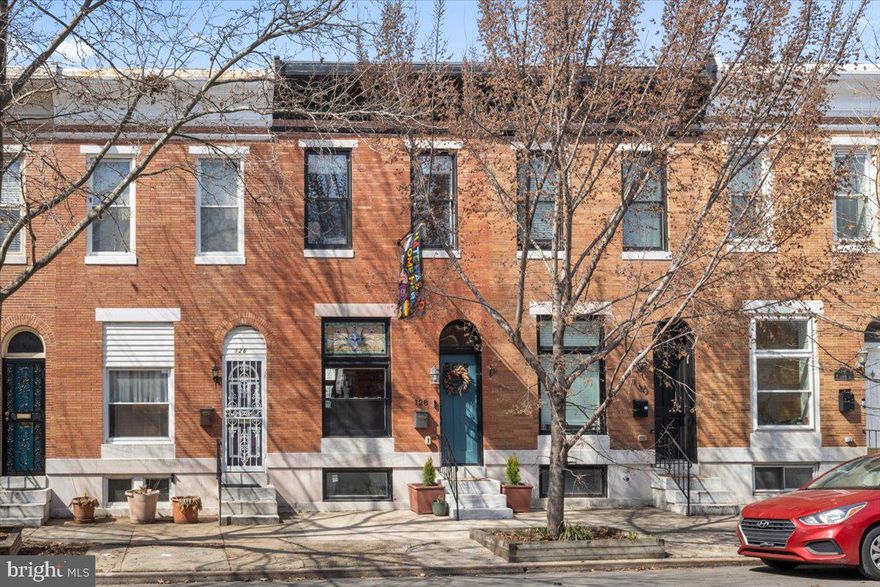 Stunning 13 foot wide brick front townhome in Patterson Park! This beautifully updated home features an open floor plan with wood floors throughout, exposed brick walls, and modern finishes. The gourmet kitchen boasts sleek white cabinets, stainless steel appliances, and a large island, perfect for cooking and entertaining. Upstairs, the primary suite offers a private bath with dual vanities, while a second bedroom and full hall bath provide plenty of space. The finished lower level includes a third bedroom and full bath, ideal for guests or a home office. Enjoy outdoor living on the rear patio with a privacy fence, your own quiet city retreat! 1 year of CHAP tax credit left! Located within the Johns Hopkins free shuttle zone.