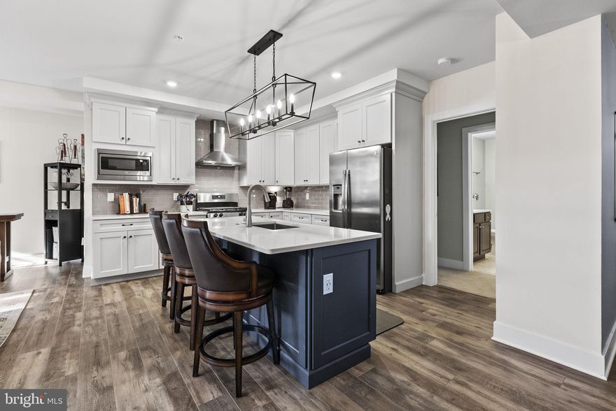 Space, space and more space!  Discover modern living rooted in history with this stunning 1,789-square-foot garden-level condo perfectly situated within a converted historic grey-stone schoolhouse just two blocks from Ursinus College.  This luxury community is a perfect investment in a quaint college town.   

C110 offers a quiet, more secluded environment in this busy stone school while being just steps away from all the community amenities including the community patio with grill & firepit; dog park, gym, art room, social room and deeded storage.  One of the many benefits of the garden-level units is having a private patio that provides you with outdoor space for your own quiet enjoyment.   Whether reading, sipping a spot of tea or planting a container garden you have this retreat to call your own.  In a “best-of-both-worlds scenario”, if you want a more open-air experience, the community patio is literally just steps away!    

You can’t beat a garden-level condo for the economic benefit of the earth’s natural insulation and retained heat and cooling and C110 still enjoys sunny blue sky and green views from its patio door and windows.    If you want more privacy then sun, you’ll enjoy the remote-controlled blinds that can be all the way up or down and, when down, can be open slats or closed.      

Our pet-friendly environment is made easy at C110 with the steps and elevator just next door and the dog park just across the visitor’s lot.   Ultimately C110 delivers a lifestyle of quiet ease, elegance, economy and accessibility. It is a brilliant choice for anyone desiring low-maintenance, high-style living in a mostly single-level layout.    

This beautiful home boasts high ceilings and an open-concept floor plan that creates an immediate sense of welcome.   The living area is centered around a cozy gas fireplace with an elegant stacked-stone facade, flowing seamlessly out to your own private patio for effortless indoor/outdoor enjoyment.    The highly functional sleek kitchen features quartz countertops; updated appliances; layered lighting and loads of storage space.  The living spaces flow effortlessly into two spacious bedrooms, each designed as a private retreat. You will appreciate the thoughtful storage solutions, including ample closet space to keep your life organized and clutter-free.  Luxury extends to the home's practical amenities, including a dedicated, full-size in-unit laundry. Indulge in the comfort of two and a half spacious, modern bathrooms, featuring sleek finishes and contemporary fixtures that transform daily routines into spa-like experiences.      

Experience walkability to in-town dining—from casual spots to fine cuisine—shopping, parks, and scenic walking trails and the college campus.   With convenient commuter access and proximity to major job centers, this bright, airy, and truly spacious home is the perfect sanctuary, whether you are a first-time buyer, someone looking to downsize, or simply seeking an unparalleled lifestyle upgrade.