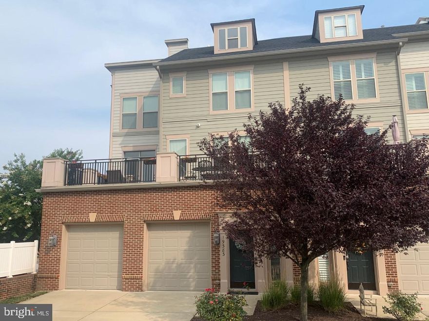 Stunning 4-Level home with an Elevator, rooftop terrace, and over 4000 square feet of luxury living!  This one of a kind dream home is loaded with over $100k in upgrades, including brand new carpet, brand new blinds and has been freshly painted from top to bottom. Situated in the famed Lansdowne Town Center you are only steps away from the areas best dining, shopping, and all of the great community events hosted in the greenspace.  The entry level offers an oversized two-car garage, wood floors and ample storage. The main level features gleaming hardwood floors throughout, two oversized living rooms, a banquet sized dinning room, eat in kitchen and access to a large outdoor entertainment area featuring over 700 square feet of deck space.  The chefs kitchen is sensational with upgraded cabinetry, under-cabinet lighting, glass showcase cabinets, stainless steel appliances, granite countertops and a large pantry.  The primary bedroom level features three large  bedrooms, each with their own walk in closet, laundry room with a high efficiency washer and dryer and two bathrooms.  The master suite rivals any estate home master suite on the market.  Featuring 15-foot high vaulted ceilings, skylight, separate sitting room, two expansive walk-in closets and a spa-like bathroom with jetted jacuzzi bathtub and rain head shower.  The bonus 4th level is a true show stopper!  This incredible space is perfect for an in-law suite, a home theater, or a private retreat.  Featuring two full window walls, a full bathroom, fully-stocked wet bar and access to the rooftop terrace with views for miles! One of only a handful of homes featuring the rooftop terrace option, this 800+ square feet outdoor oasis captures picturesque views of the Blue Ridge mountain range, holiday firework celebrations and the feeling of absolute exclusivity!  Live a life of convenience and ease! The community HOA package provides home owners with trash removal, snow removal, yard maintenance, a sparking swimming pool, state of the art fitness center, onsite resident business lounge and high-speed internet access!  This is the one you have been dreaming about with a 2 car garage, 4-levels, full house Elevator, 4000+ square feet, 2 outdoor terraces including the breathtaking rooftop deck, 3 bedrooms, 4 bathrooms, this home has it all! Your lifestyle of luxury awaits!