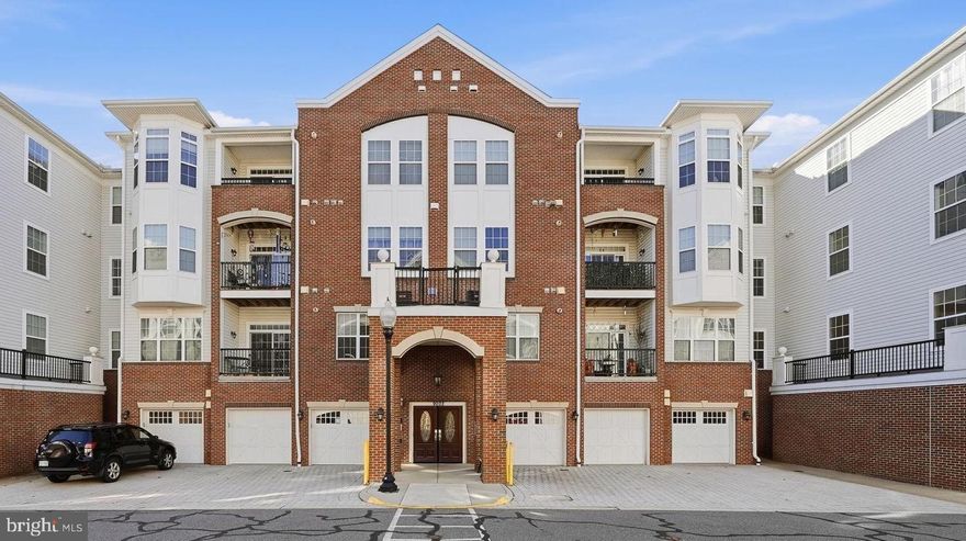 Welcome to this bright and inviting condominium in The Gatherings, a sought-after 55+ community ideally located less than three miles from Historic Downtown Manassas and the VRE. Enjoy low-maintenance living with a secured entrance, elevator access, and community room, all designed for comfort and convenience. This home welcomes you with an open floor plan that feels warm and spacious from the moment you step inside—perfect for everyday living and entertaining. Offering 2 bedrooms and 2 full bathrooms, the layout provides generous space throughout. A separate dining room offers flexibility and could easily serve as a home office or hobby room. The kitchen features stainless steel appliances, ample cabinet storage, and plenty of workspace. The living room opens to a private back patio where you can relax and enjoy a beautiful view. The oversized primary bedroom easily accommodates a sitting area and includes large walk-in closets. A dedicated laundry room with full-size washer and dryer and built-in cabinetry adds to the home’s thoughtful design. With a fresh coat of paint, this condo is ready to become your ideal retreat for relaxed, carefree living. Additional highlights include a private one-car garage, an assigned parking space, and ample visitor parking.  All of this in a fantastic location close to shopping, fine dining, and the charm of Old Town Manassas—this is a wonderful place to call home.