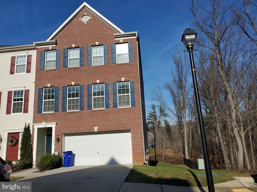 An end unit with a brick front, a three-level extension, an open floor plan with recessed lighting, and many windows produce natural light. The kitchen features granite countertops, stainless steel appliances, 42-inch cabinets, a gourmet island, a dining area, and an extension off the deck. The upper level features new carpet, high ceilings, a master bedroom with a walk-in closet, a sitting area, a walkout basement with a walkout level, a 2-car garage, and a wood deck. Robin Nature Center is close to nature trails.   Available on 9/1/2023