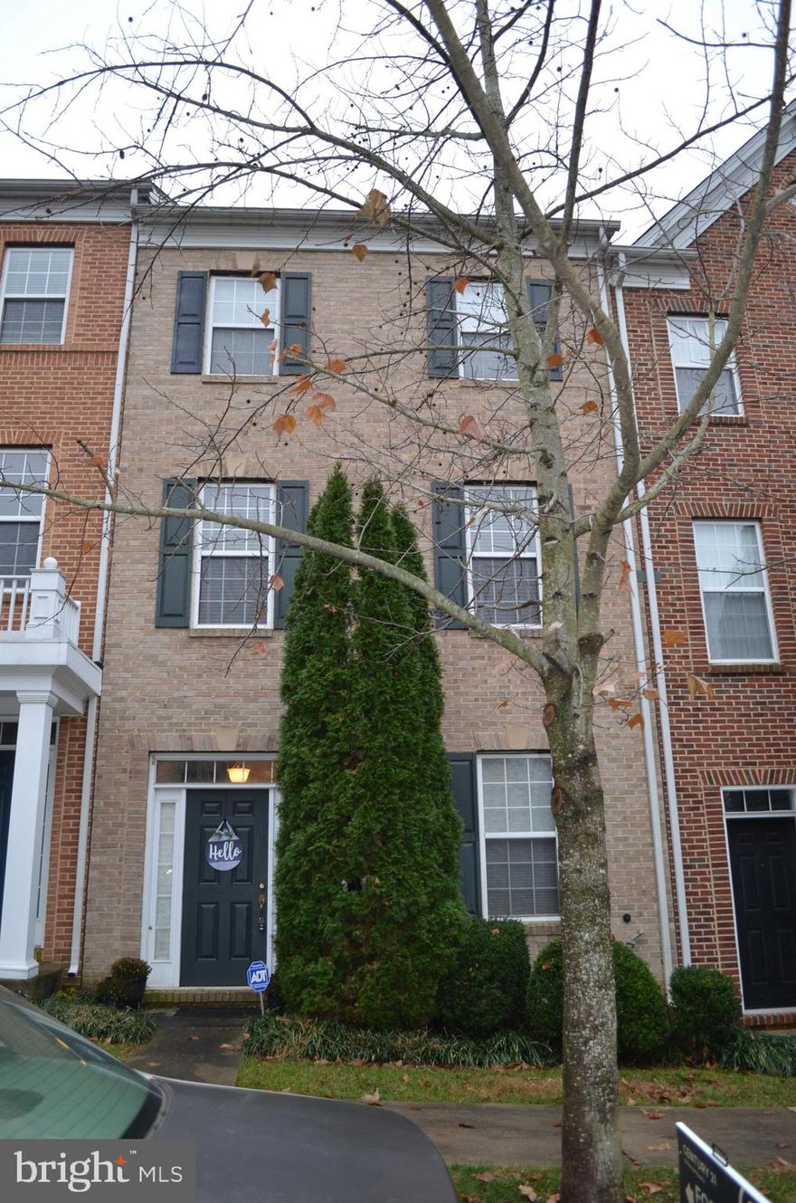 LOCATION!! Minutes to everything  - shopping, restaurants, including 270, This Beautiful brick front townhome is located in the Hidden Creek Community.  Open floorplan with stunning hardwood floors  throughout main level!  Upgraded kitchen with granite counters, beautiful tile backsplash, stainless steel appliances and gourmet gas cooking! Fabulous gas fireplace creates ambiance. Washer/dryer on upper level for convenience. 1st floor has large room that can be office/den or additional bedroom. Two car attached garage with driveway. Community pool and tot lot/playground just around the corner. Available 1/1/24