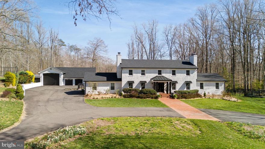 Indulge in the epitome of equestrian luxury situated on 6.24 acres in a serene countryside just 30 minutes outside of Washington D.C. , 8511 Cathedral Forest Drive boasts a grand brick home with over 5,700 square feet of living space, including 5 bedrooms and 5.5 baths. This unique property features two owners suites, one on the main level and one on the upper level as well as a detached guest quarters.  The main house has four inviting wood burning fireplace hearths with new professionally installed woodburning stoves, gorgeously refinished hardwood floors on the top two levels and an English walk up exit from the lower level.  The home's inviting two-story foyer sets the tone for elegance and entertaining with spacious rooms perfect for an intimate gathering or large crowd. To the left of the entry foyer is a warm living room with ample seating and to the right is a large dining room recently renovated with new lighting, decorator paint, and a long built in cabinetry on one wall with leather granite top.  The heart of the home is a stunning gourmet kitchen with large island and new leather granite countertops and backsplash, pantry, new stainless appliances including double wall oven, stainless steel sink, cooktop.  The kitchen is adjoined to a lovely family room with vaulted ceilings and picturesque views featuring a wet bar and access to the outdoors. The large family room with wood beams and ceiling has expansive windows with views of the resort like patio and salt water pool amidst the back drop of the rolling hills.  Both owners suites offer luxurious retreats with spa inspired renovated baths and custom built in closet systems.  The expansive lower level boasts a movie theatre, home gym (5th bedroom), full bath, wood burning fireplace, pool table, and wet bar all surrounded by warm built in cabinetry that ties the space together.  The list of features and upgrades goes on and on!  Please see the document section for the full list! The home comes with whole house generator and all the major systems have been replaced recently including a brand new roof, gutters and an extensive exterior renovations.  Beyond the attached two-car garage, discover a detached three-car garage with RV bay, workshop, and upper-level office or guest house.  A professional 3-stall horse barn and run in sheds complete with amenities like a hot water heater and an outdoor riding arena, and two paddocks add to the allure.  The main house has two laundry rooms, and the detached garage workshop/ guest house has a third set of washer and dryer.  Nestled between Occoquan and Clifton, Fairfax Station offers city amenities with a tranquil atmosphere, while nearby parks and shopping centers provide convenience and recreation just minutes away.  Escape to your own private oasis, where luxury meets tranquility.  Don't miss this rare opportunity to make this remarkable equestrian property your own.  Schedule a viewing today and experience the unparalleled beauty of 8511 Cathedral Forest Drive! Seller has an assumable VA loan at 2.25% interest rate. Showings are by appointment only with 24 hours notice. Do not disturb sellers or enter the property without listing agent permission.