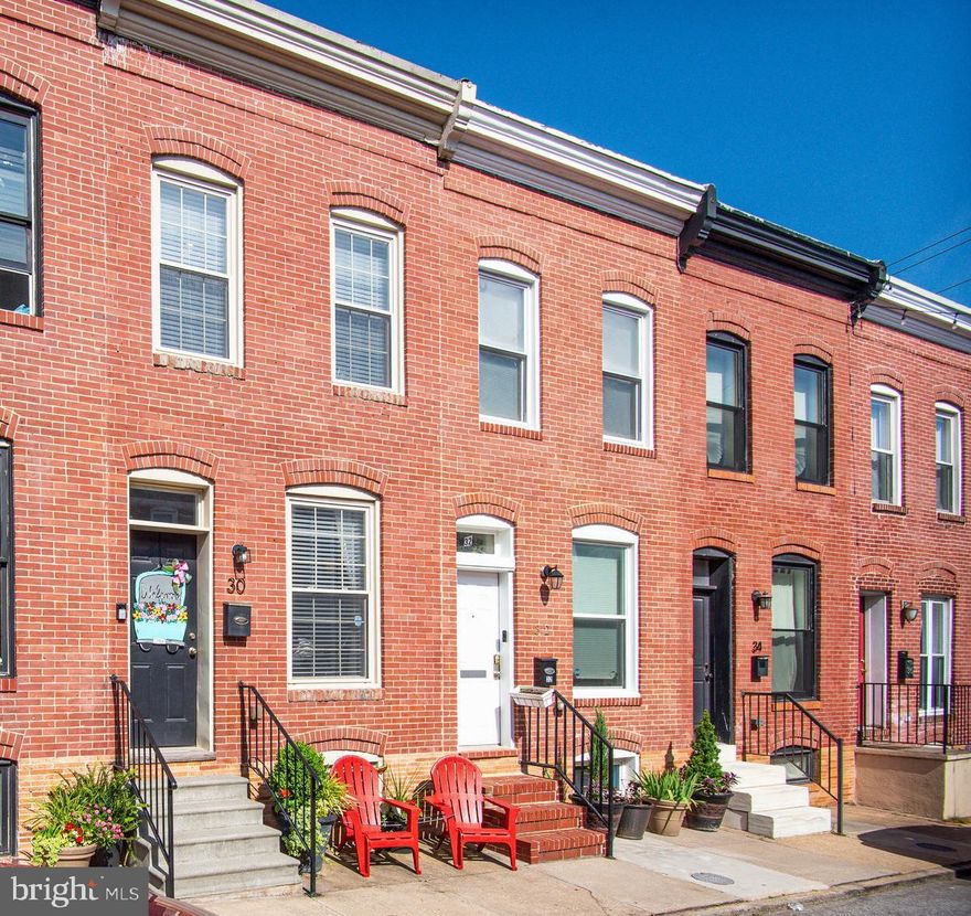 Welcome home to 30 North Curley Street! This charming and well maintained brick rowhome has private parking and is only steps from beautiful Patterson Park. It's a very short distance to the Canton/Fell's Point waterfront, Johns Hopkins Hospital, Highlandtown Arts and Entertainment District, restaurants and shopping. Both I-95 and I-83 are within a couple miles for easy travel outside the City. The main level has an inviting open floor plan with wonderful natural light, LVP flooring and exposed brick. There is a spacious living room, kitchen with dining area, and a half bath. The exposed brick continues on the stairs to the upper level which has two bright bedrooms, high ceilings, and a full hall bath. The large unfinished lower level has a laundry area and abundant storage. The rear porch which is perfect for relaxing outdoors is just off the kitchen. The adjacent parking pad is easily accessible from the rear alleyway. Don't miss the opportunity to own this lovely home. Schedule a tour today!