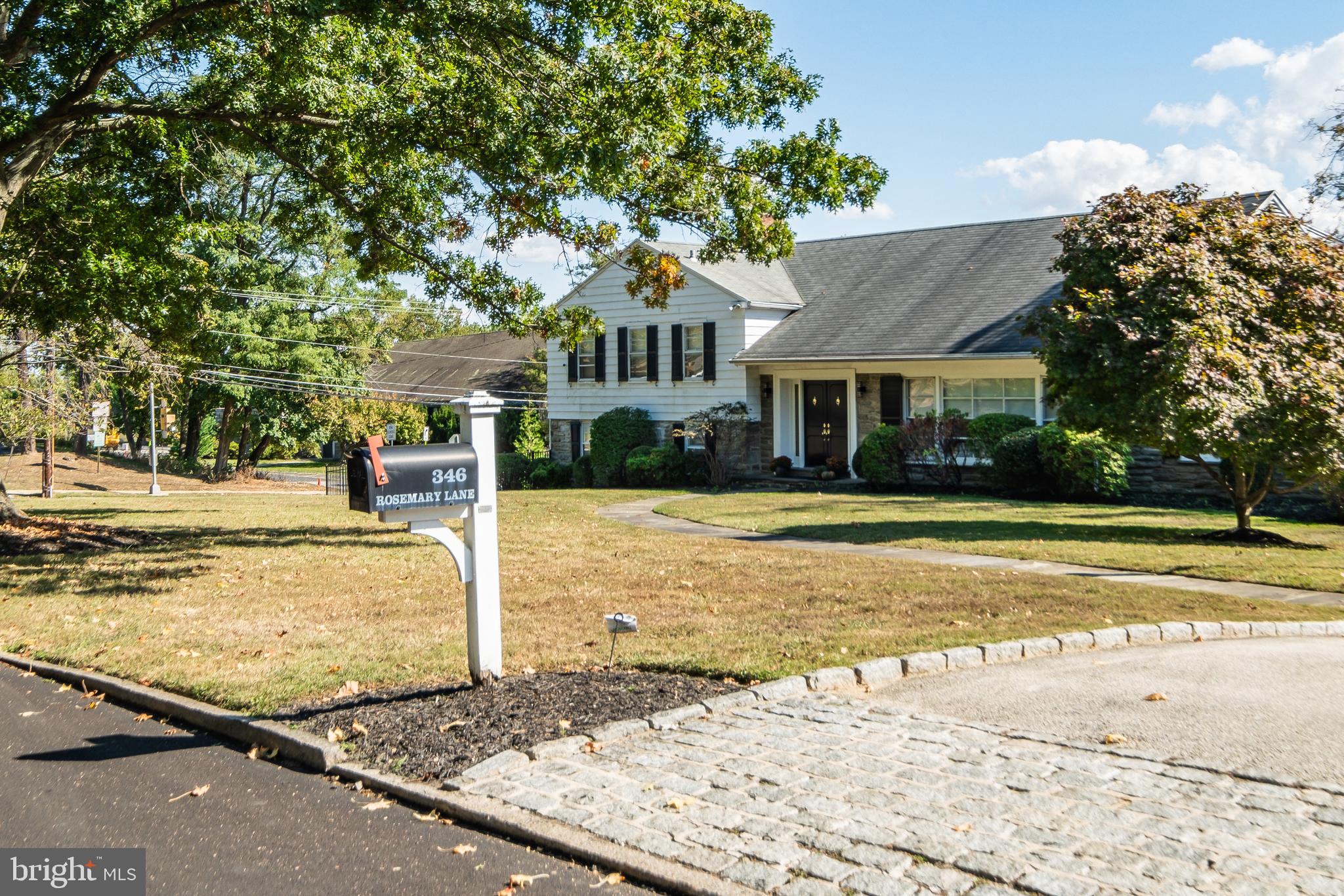 Extraordinary opportunity in Penn Valley: 346 Rosemary Ln has been totally reimagined by current owners. Incredible features/finishes throughout! Floor plan lends itself to both everyday, modern family living as well as larger scale entertaining. Custom kitchen w/ shaker-style cabinetry, quartz counters, pro-style appliances, and oversized island centers the main level, and is open to the living room, informal dining space, and an additional family room with gas fireplace overlooking the patio and large, flat grassy rear yard. New lower level in law/au-paire suite with full bath. A stylish, functional addition houses a walk-in pantry, mudroom and laundry w/custom cabinetry, powder room, and access to the attached, two-car garage. Upstairs primary bedroom w/ en-suite bath. 3 additional well-proportioned bedrooms, a home office and classic hall bath w/ marble vanity and tub/shower complete the upper floors. Additional attic storage as well. One of the Main Line's favorite neighborhoods, a short walk to schools, and w/ close proximity to the Main Line's premier dining, shopping, and lifestyle destinations. Award-winning Lower Merion public schools, prestigious private schools, houses of worship, and a short commute with easy highway access to world-class cultural institutions in Center City Philadelphia.